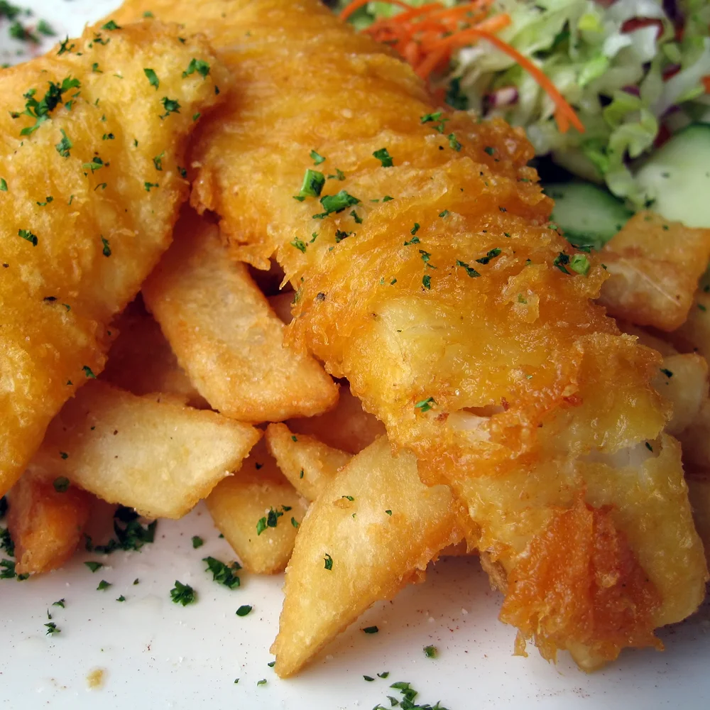 Traditional Fish & Chips Cooked in our own special batter served with chipped potatoes, garden peas, lemon wedge & tartare sauce £9.50