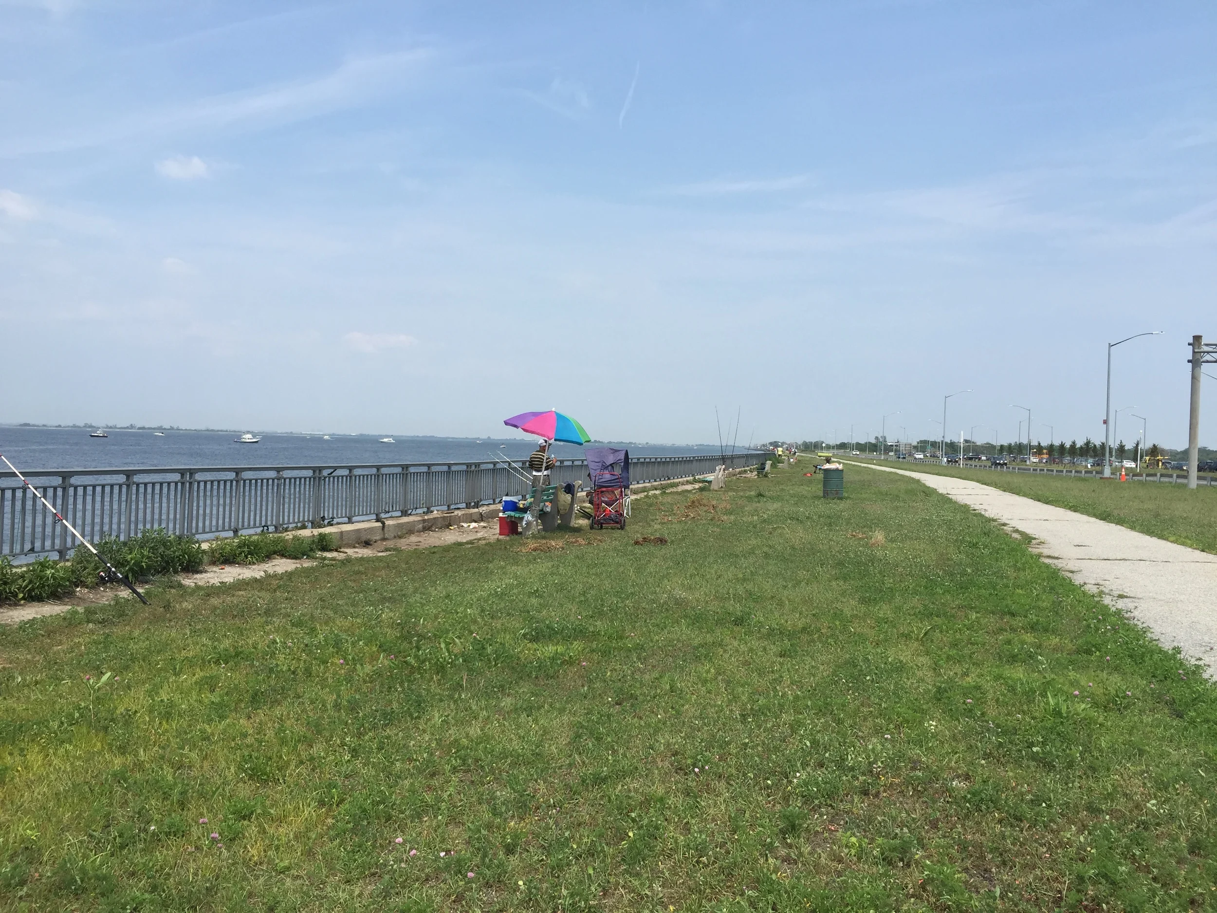 Passing a line of fisherman next to the Gil Hodges Bridge on a sunny Saturday