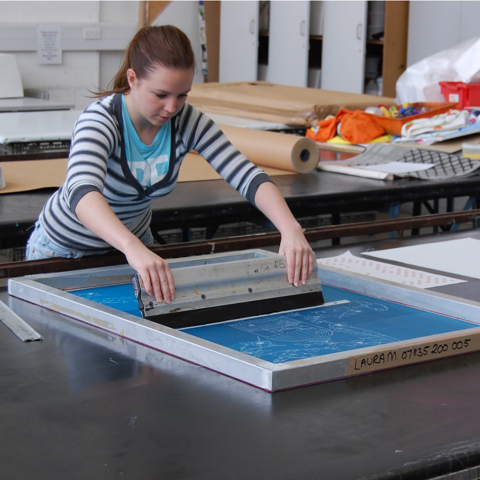 Screen printing a single shirt.