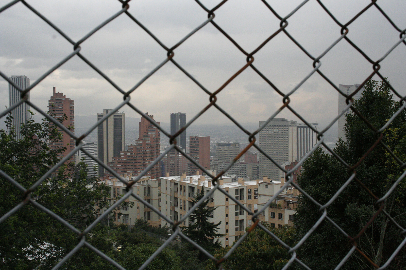 Bogotá as seen through a roadside fence along the Circunvalar- a winding, mountainside alternative to the main north-south artery, l a Séptima