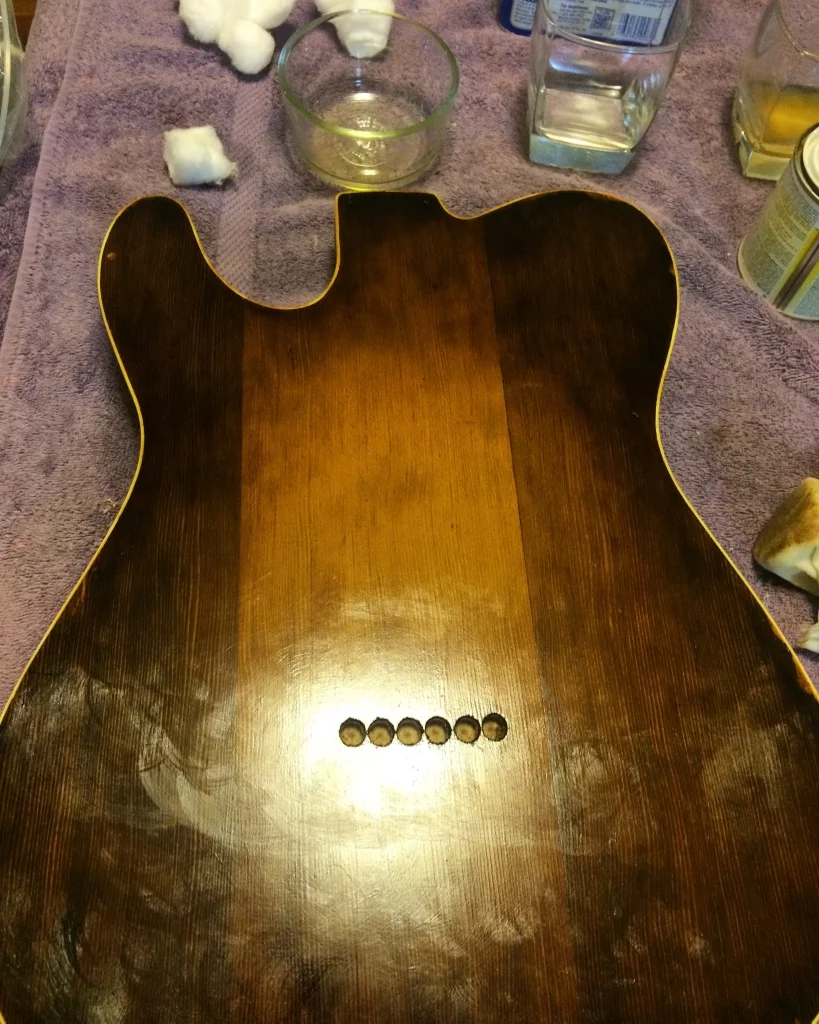 What you see here is a thin layer of dissolved lacquer rubbed on with oil to keep the pad from sticking as the lacquer dries in place. The swirly bits are oil that rise to the surface and get wiped off at the end. It's a fun process, but really stressful for the first time. I kept thinking..."why didn't I just spray it"