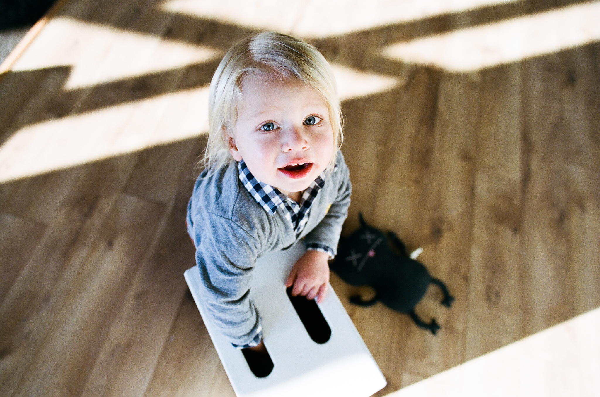 Child trying to lift an apple box