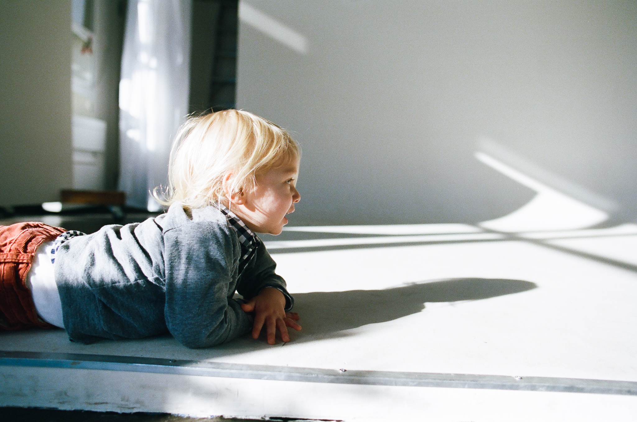 Child and his shadow on a cyc wall