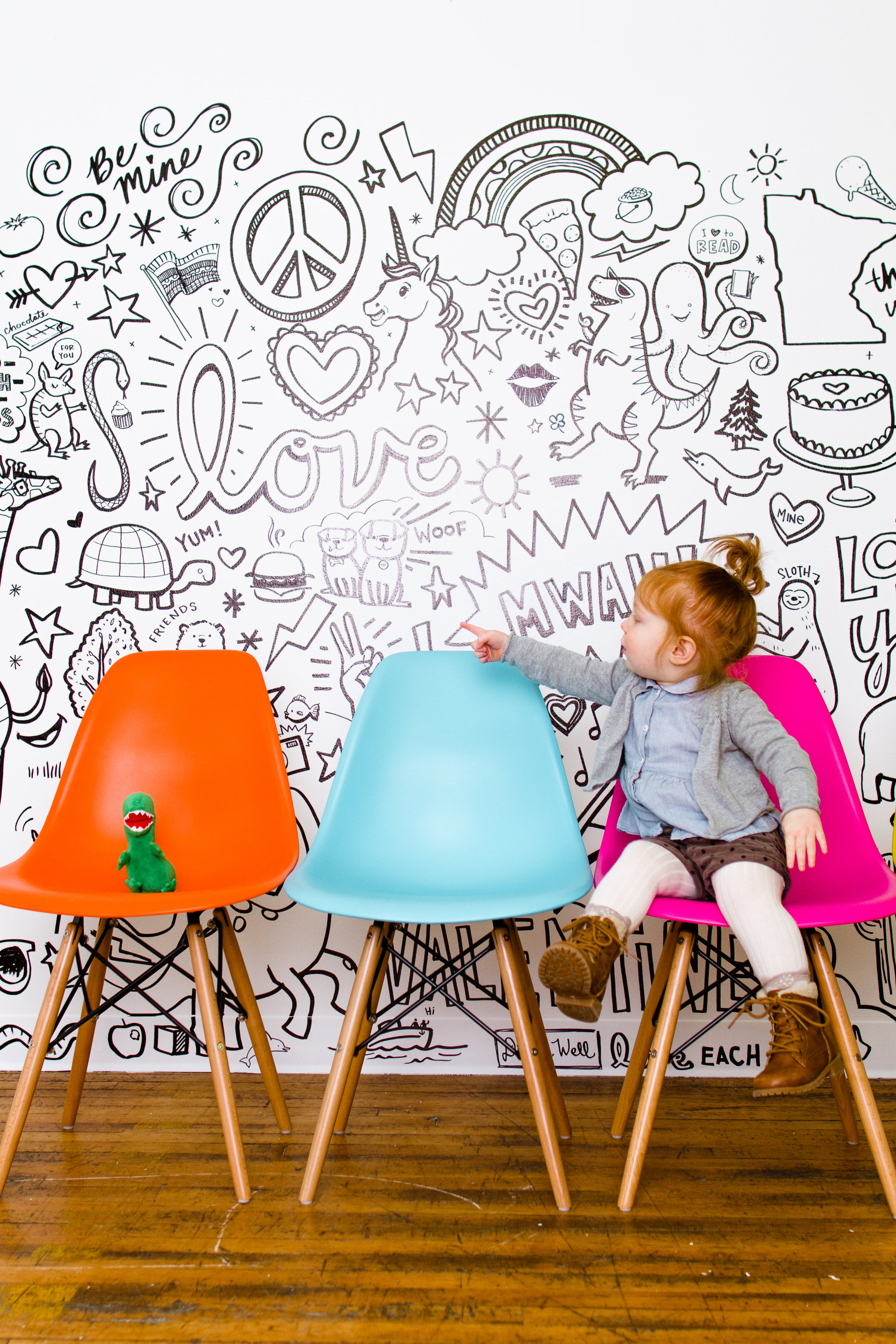 Colored shell chairs in a modern portrait studio