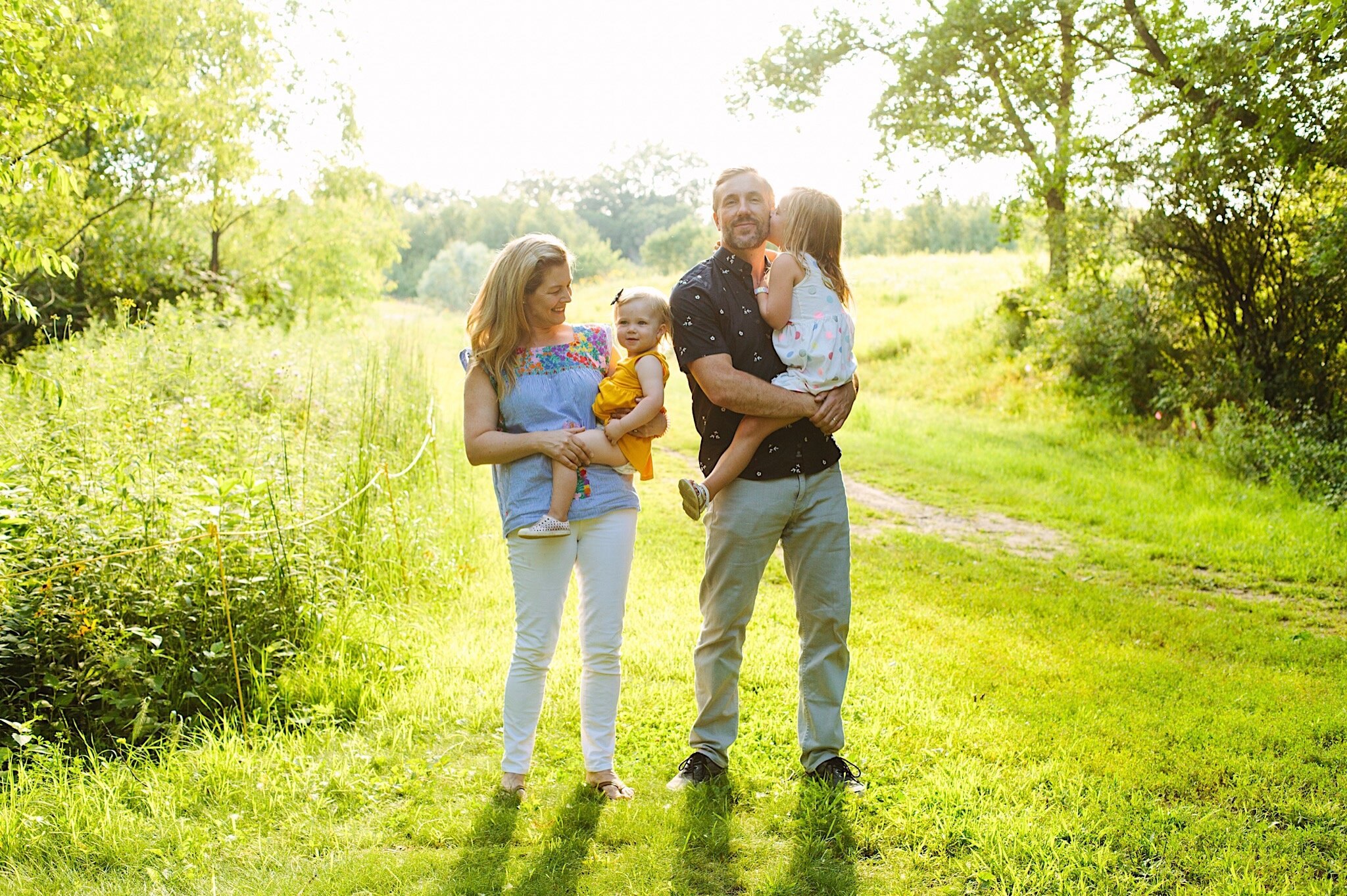 A family standing together during a family portrait session in Minneapolis, Minnesota