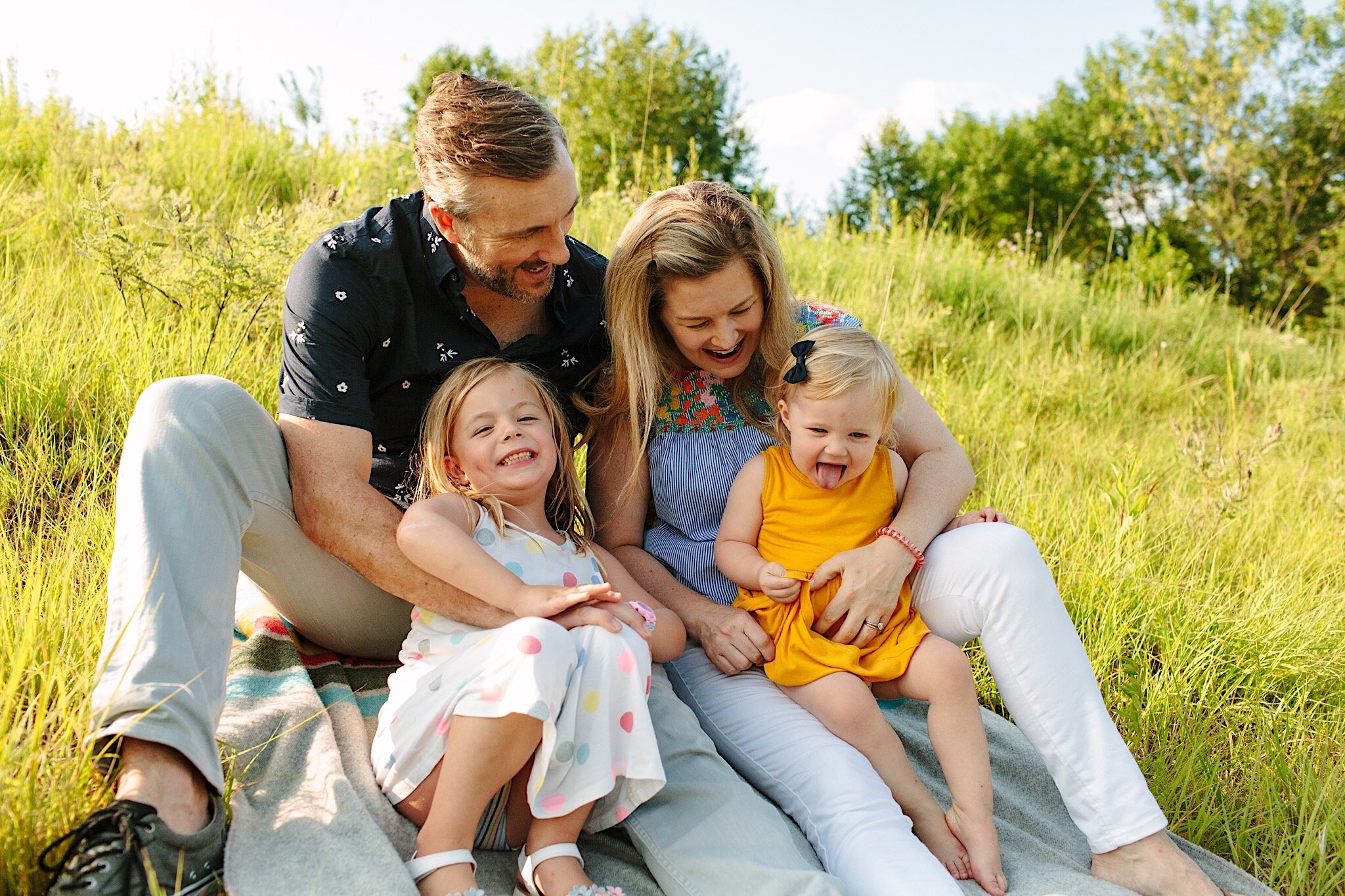 Family portrait photography in a grassy field in Minneapolis