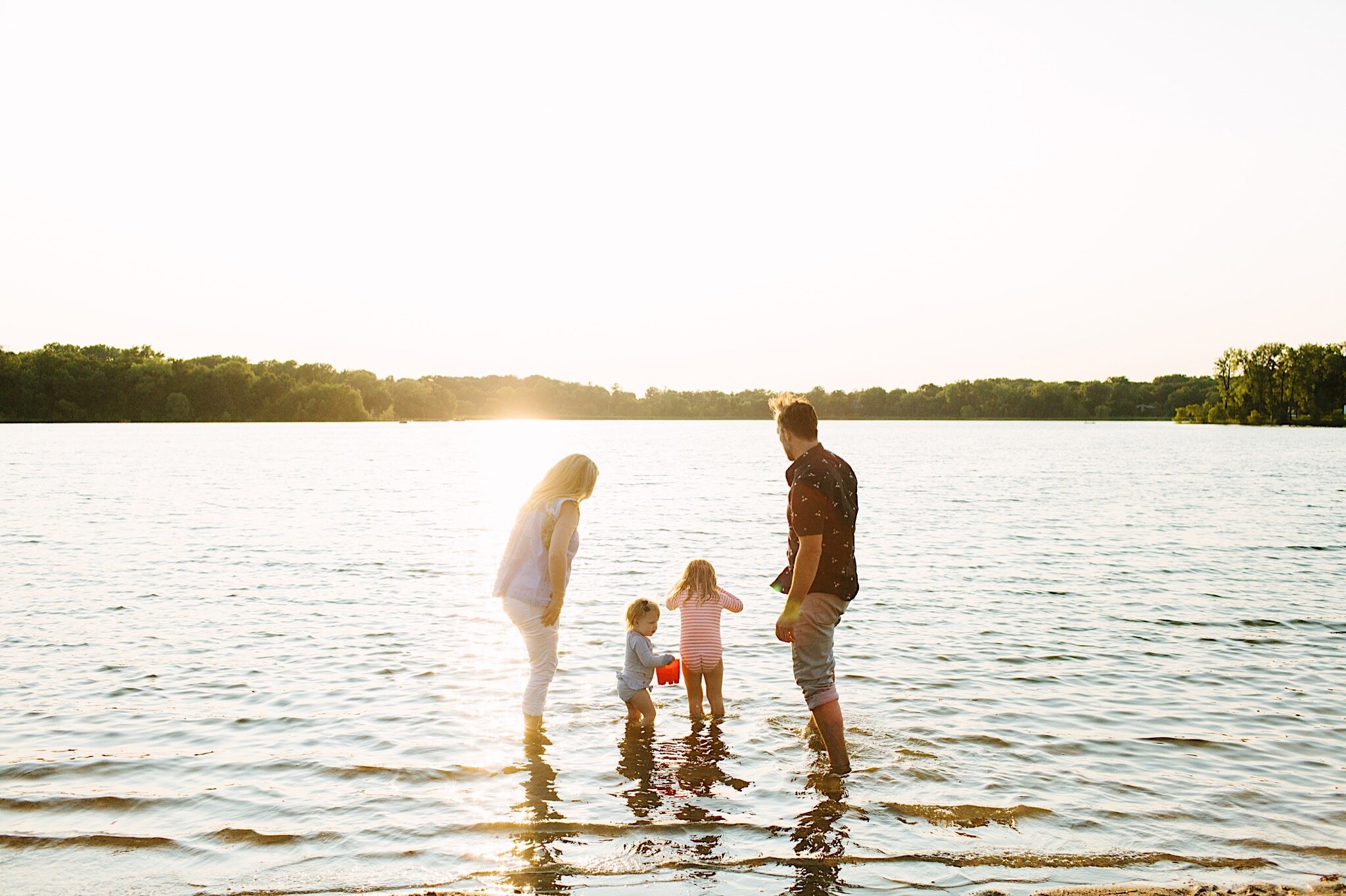 A lifestyle family portrait session during golden hour at Bush Lake Park in Bloomington, Minnesota