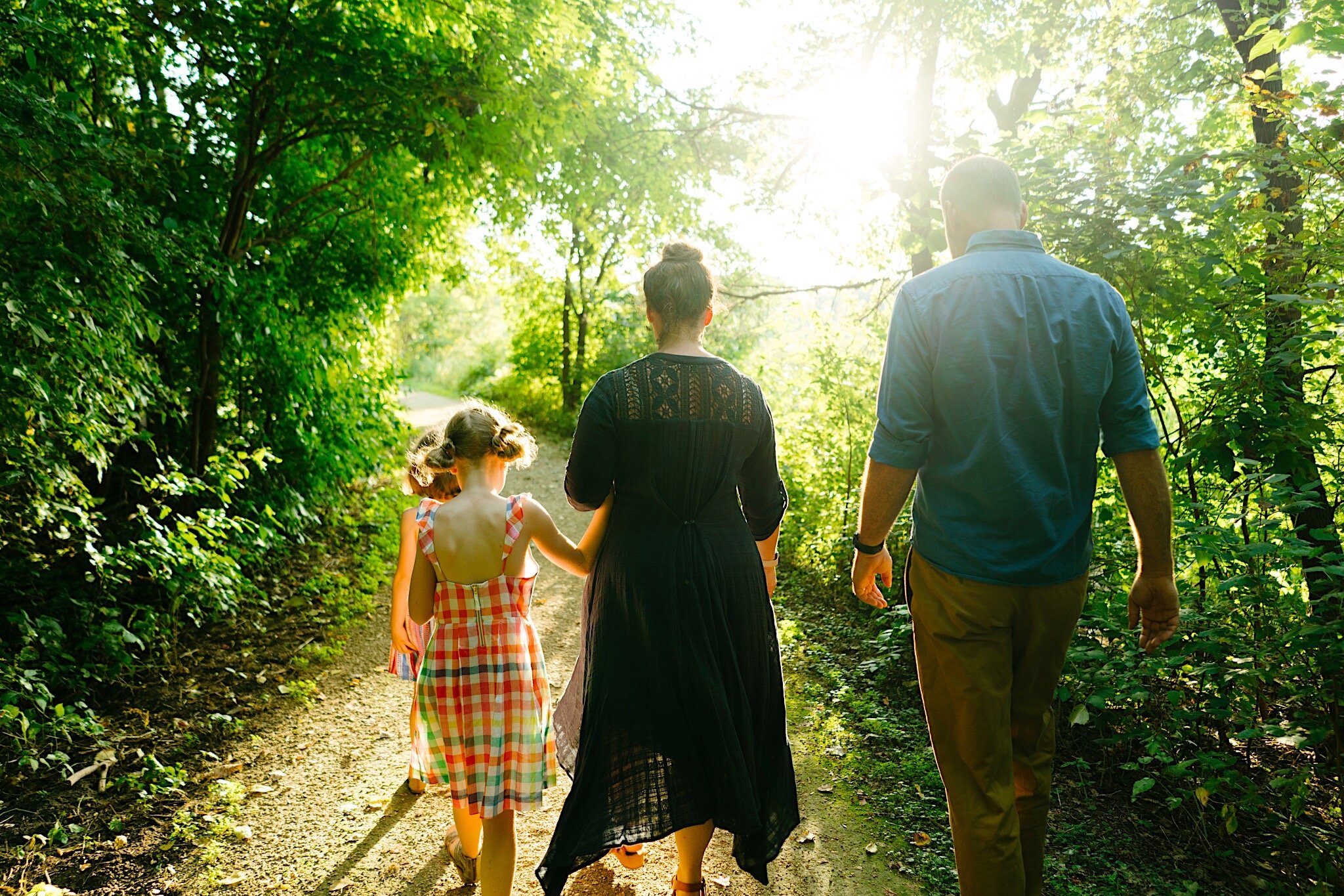 A lifestyle family portrait session at golden hour in Minneapolis