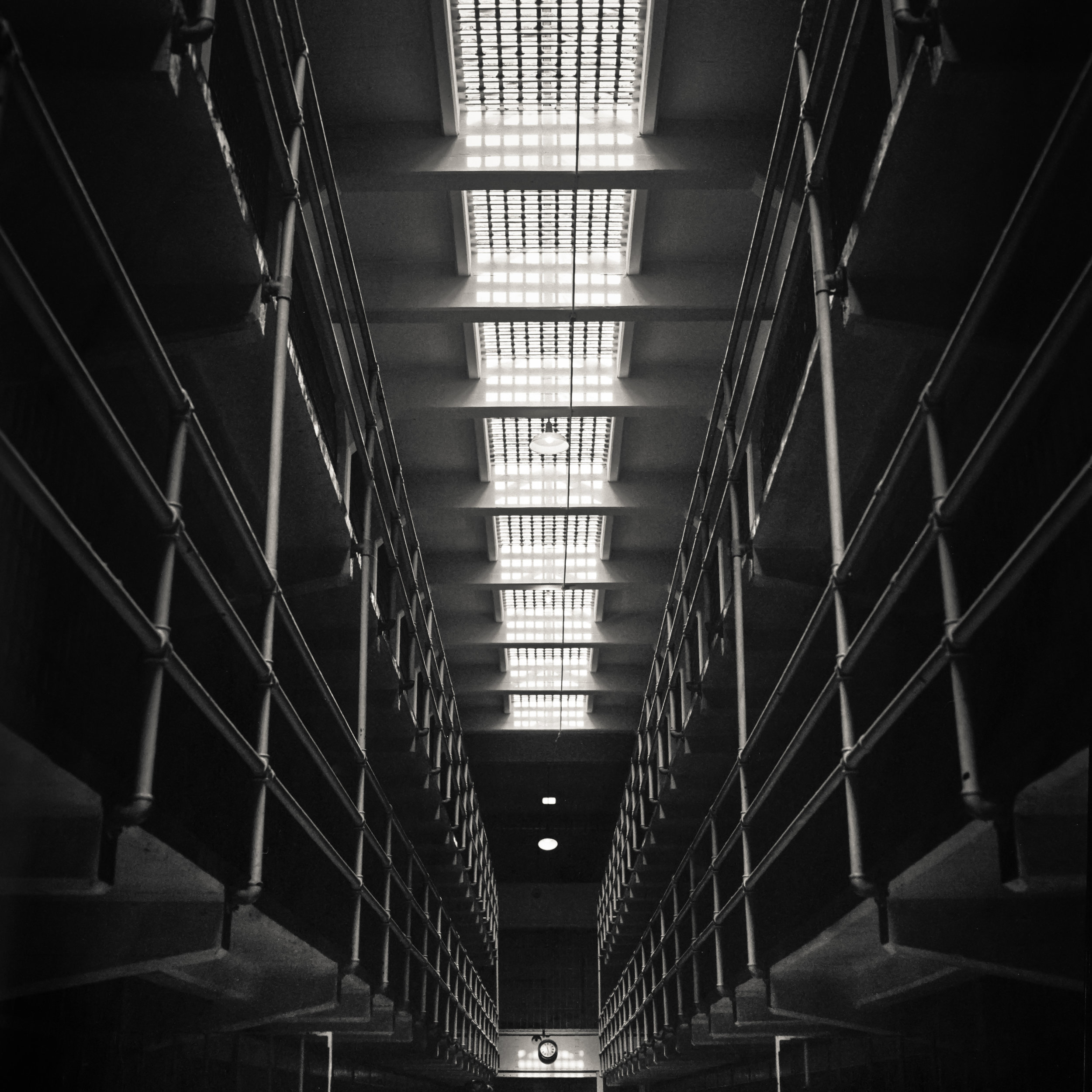 Alcatraz black white jail cell corridor dark ominous haunted