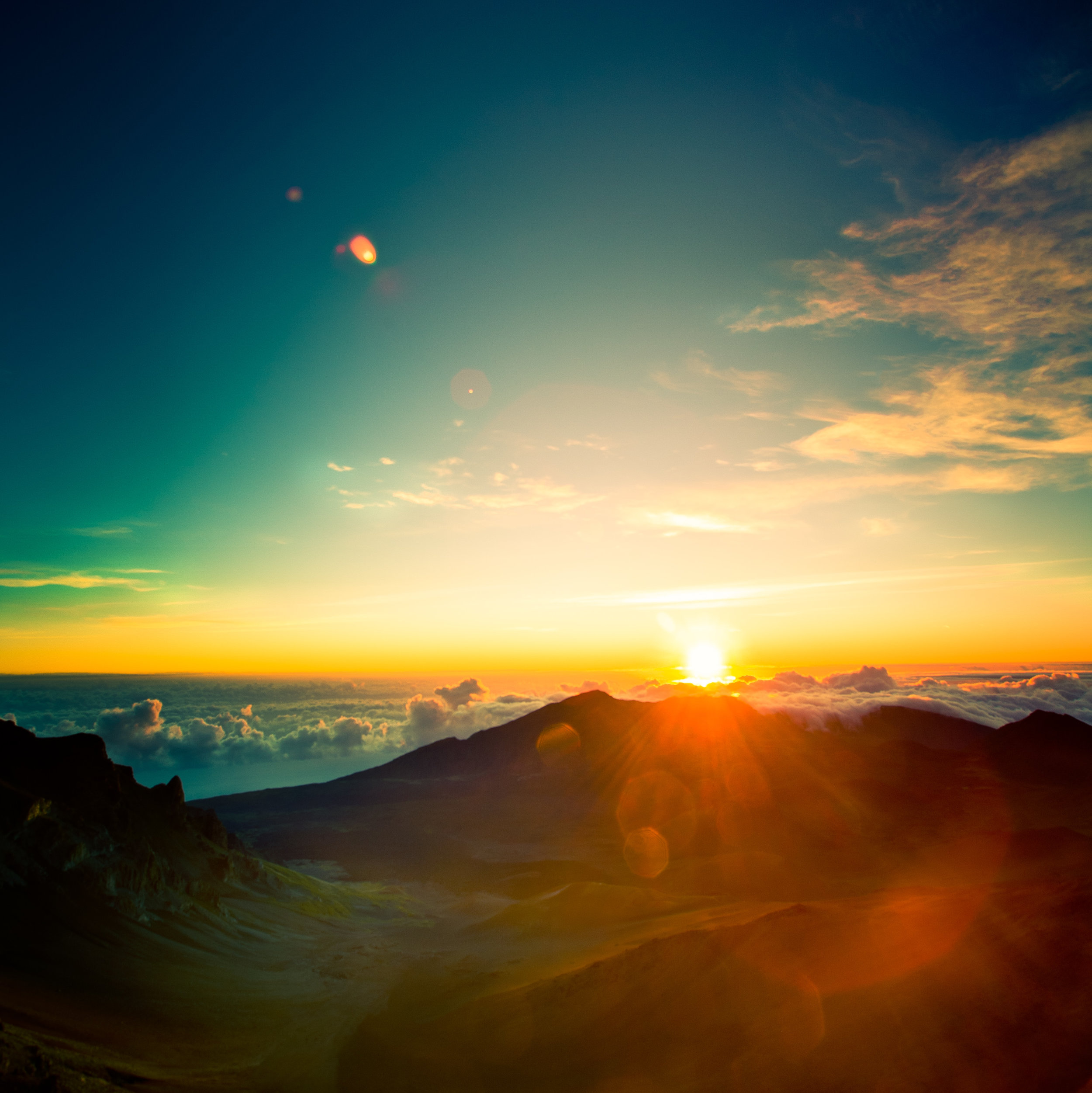 Maui Haleakakla sunrise clouds house sun flare joy wonder