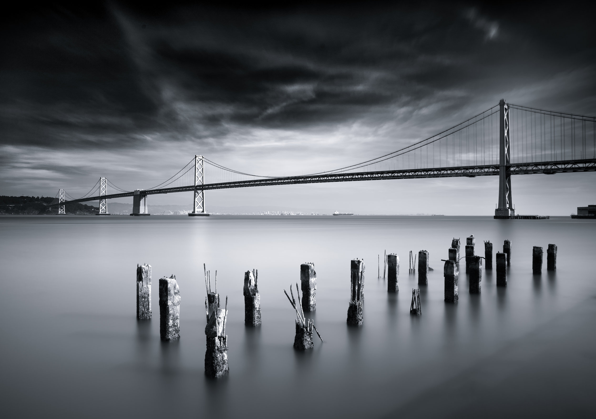 San Francisco black white bay bridge pier pilings