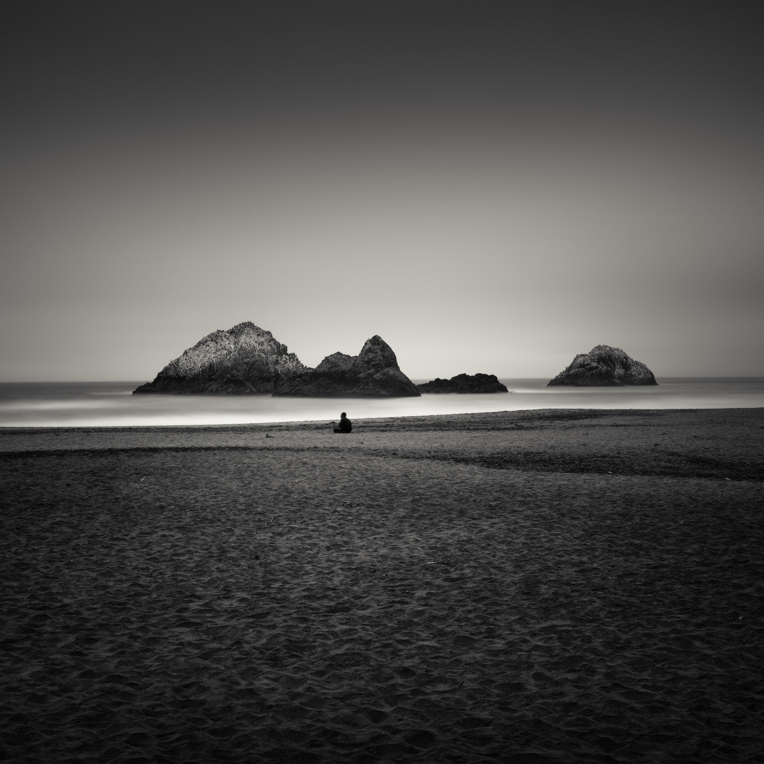 San Francisco black white sutro baths beach sole figure meditation awareness calm