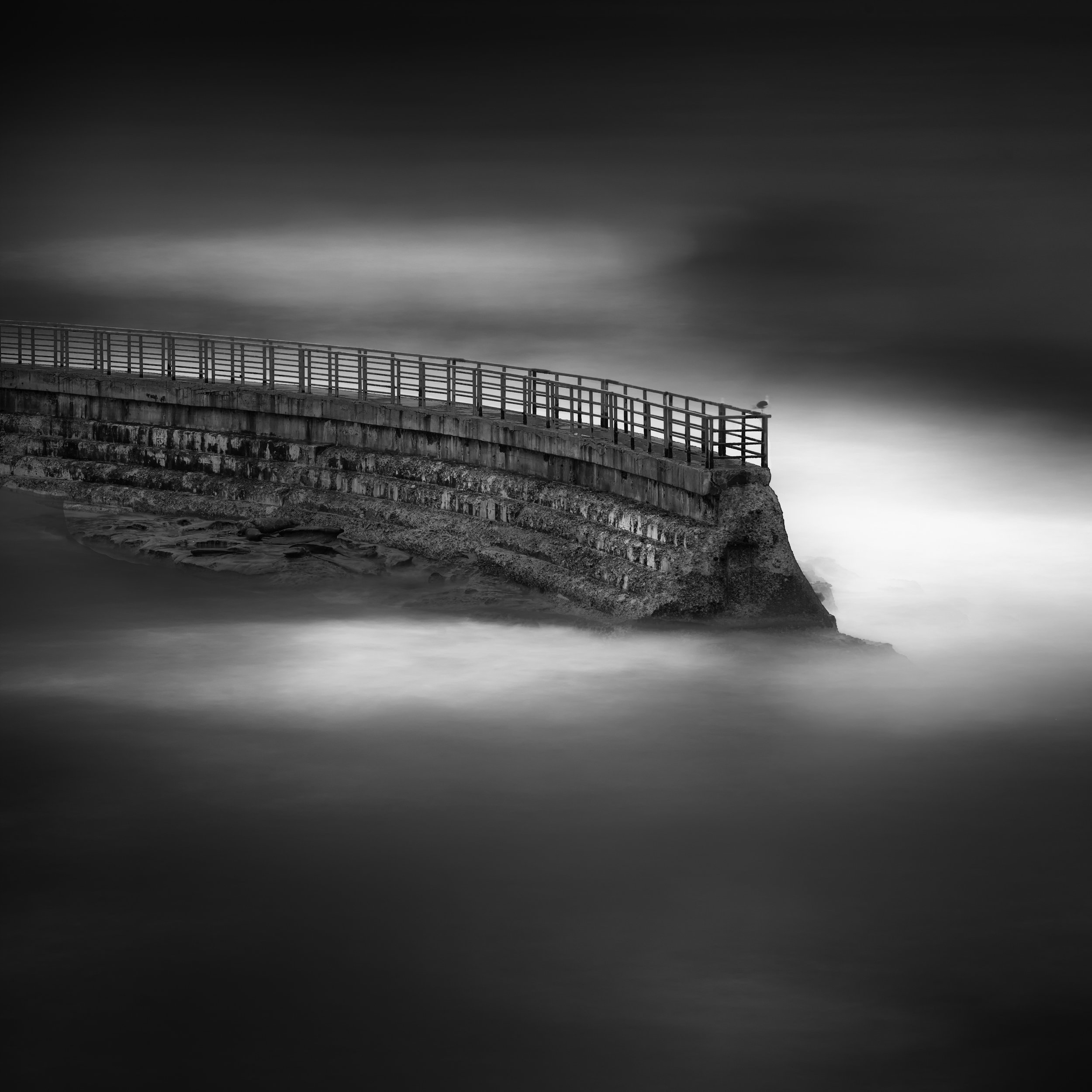 La Jolla black white children pool wall waves void dark moody