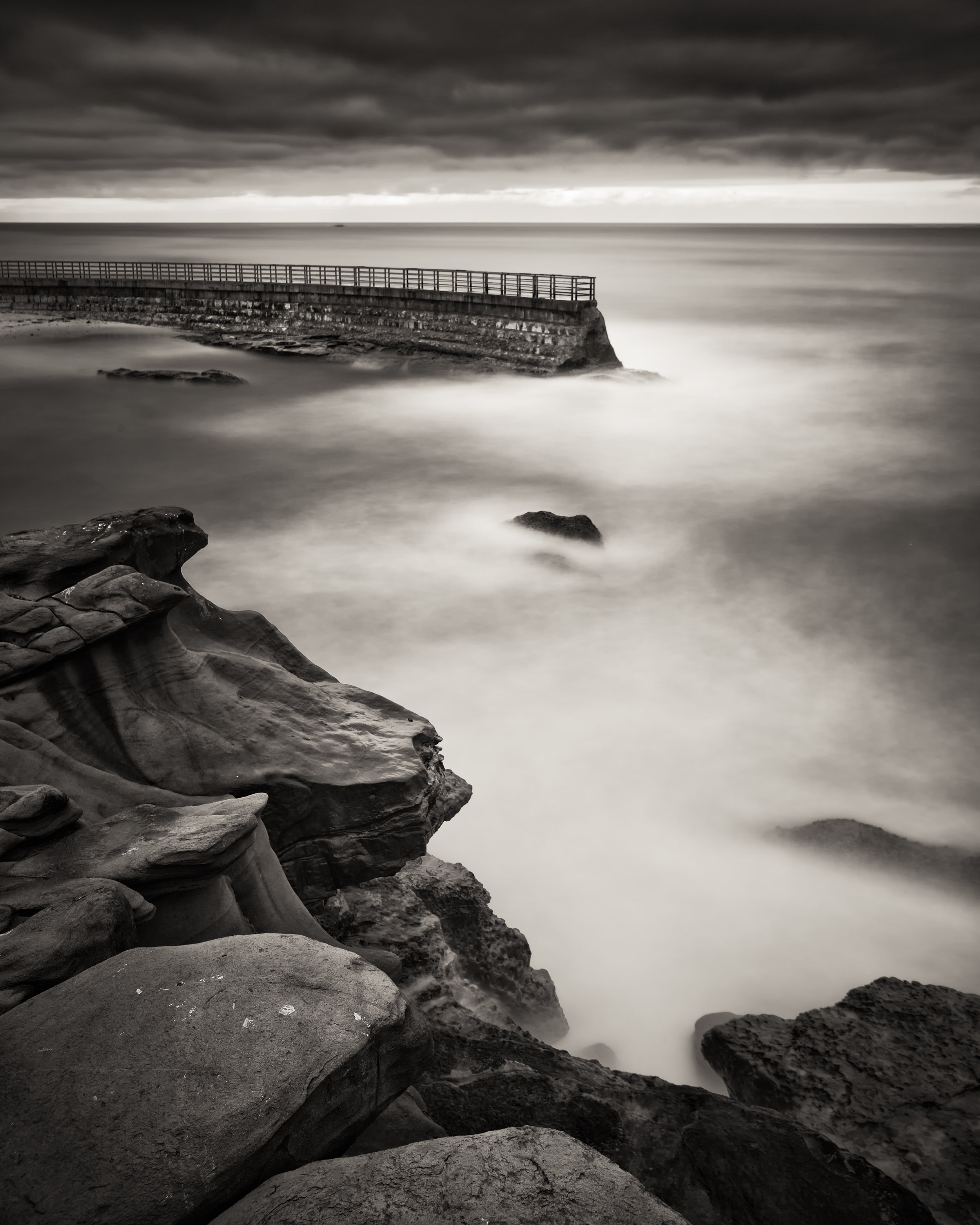 La Jolla black white children pool waves wall lurking beneath