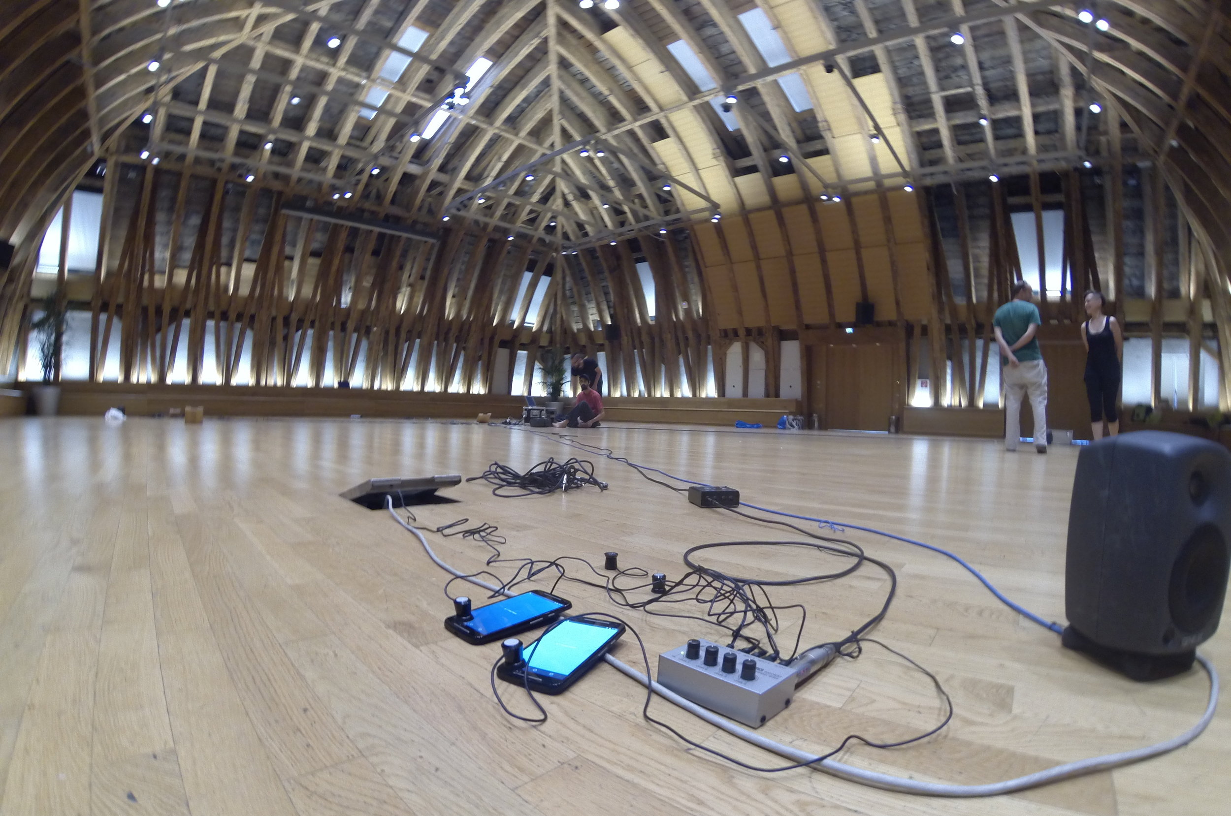 Figure 2. Using pick-up coils to augment smartphone sound in an experimental setup at Kuppelsaal (Vienna University of Technology)