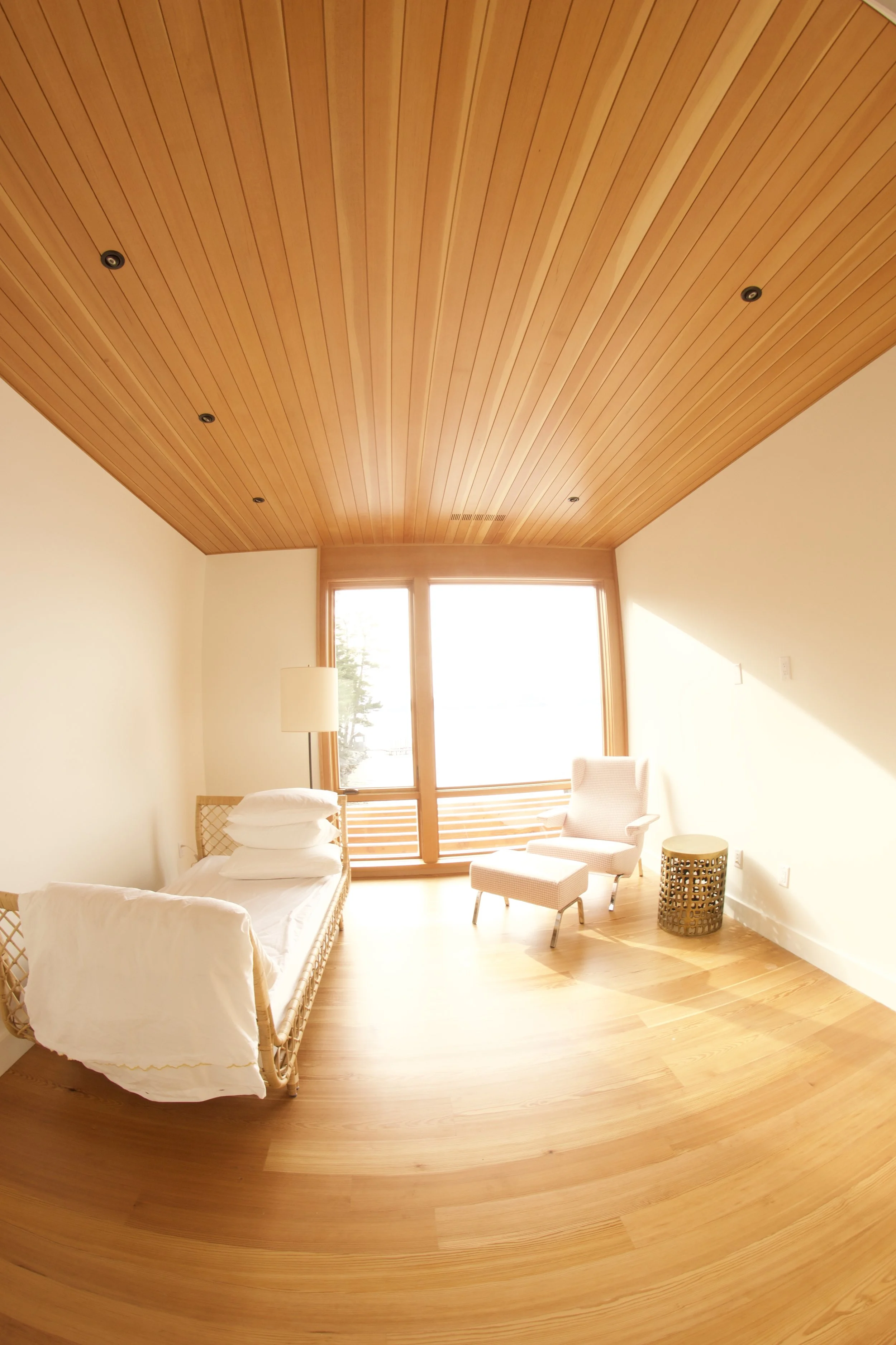Sun room composed of clear vertical grained Douglas fir and old growth pine flooring. Finishes are 13% sheen at 90 degrees.