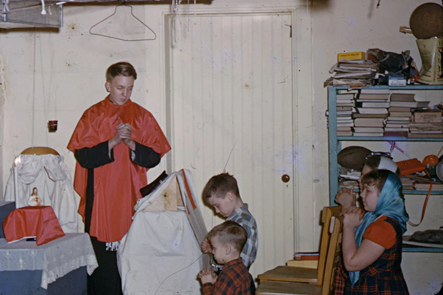 Kid's Christmas? Dad standing and Judy in the headscarf (1952).