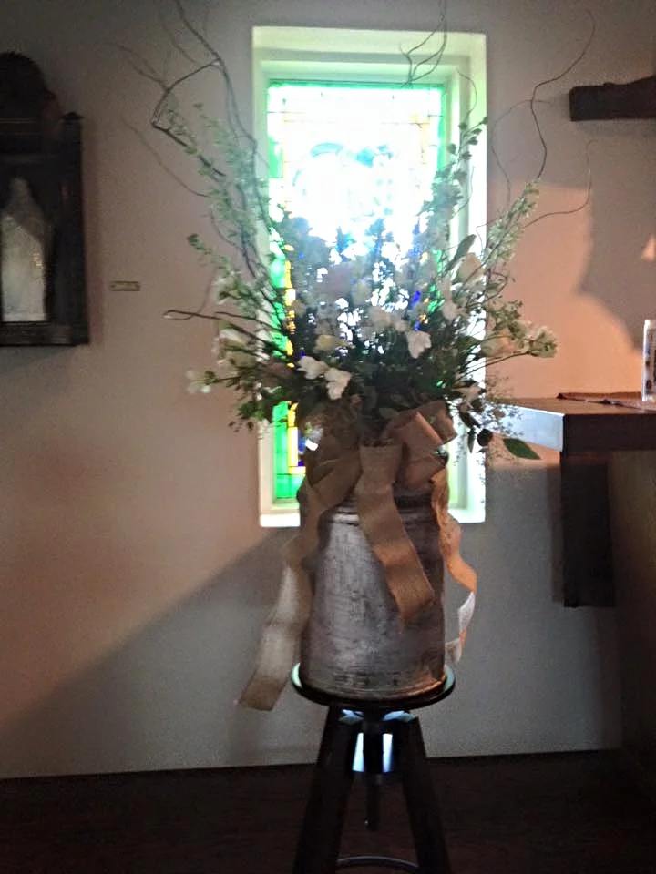 Rustic antique milk jug centerpiece