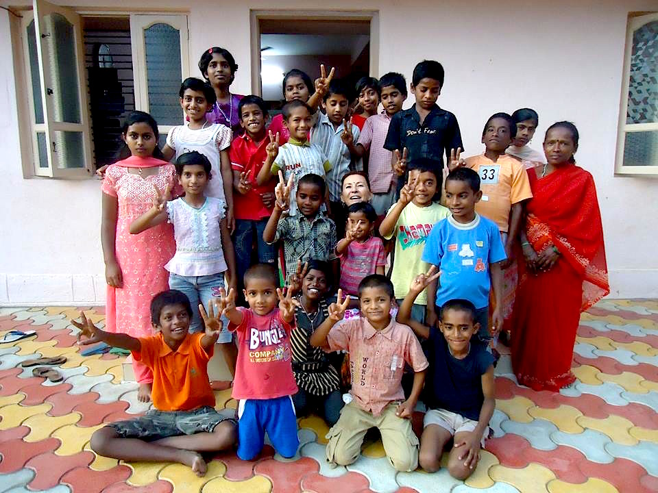 Kids and staff pose for a photo at the&nbsp;Snehalaya Children’s Care Centre for HIV-infected orphans in Mysore, India