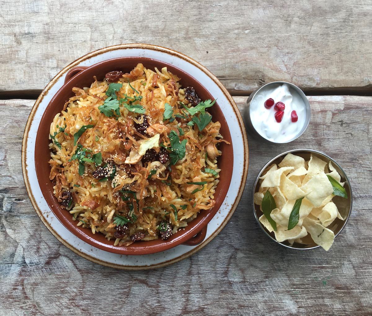 KERALAN CHICKEN BIRIYANI WITH POPPADUM STRIPS & POMEGRANATE RAITA