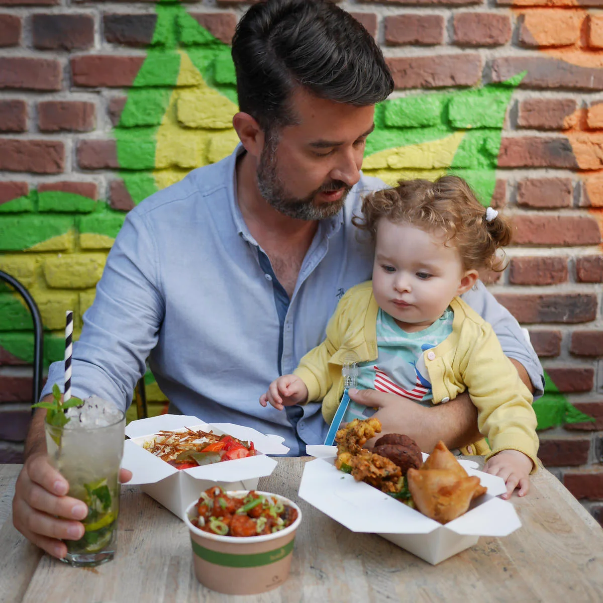 Co-founder Euan lunches at the Brighton Lanes Cafe with his 18-month-old daughter Astrid