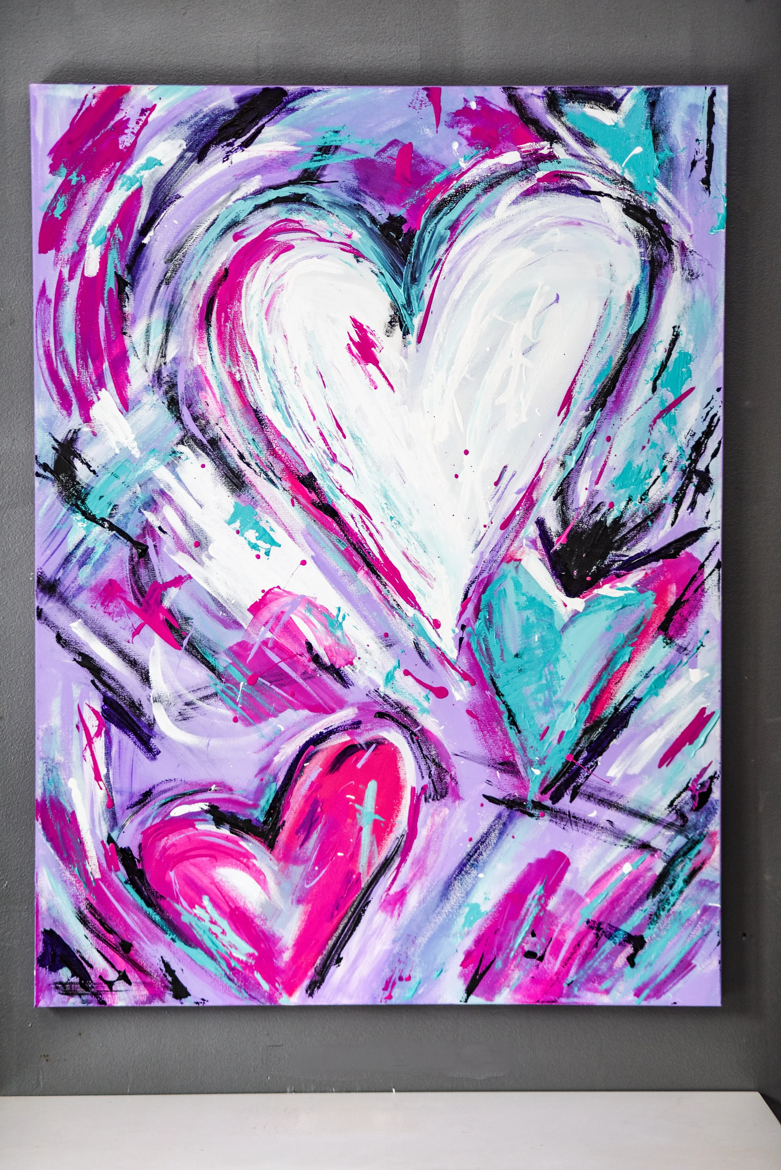 a painting of abstract heart shapes