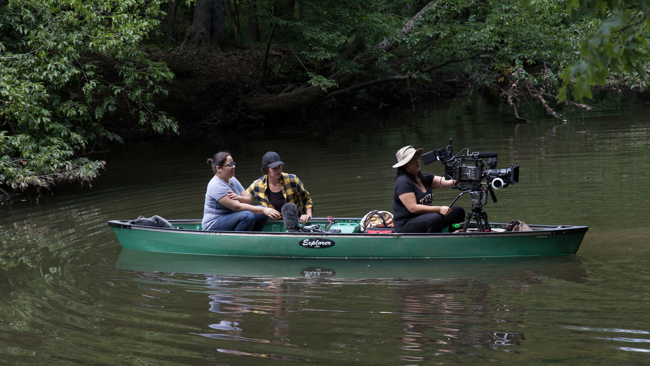  Associate Producer Elaine Strutz guides AC Leyla Perez and DP Christine Ng through waist deep water. 