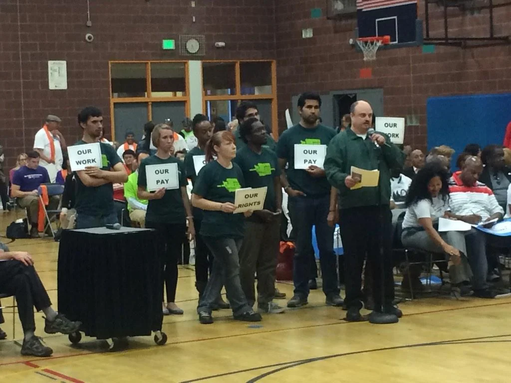 Jason Harvey tells City Council about the prevalence of wage theft and the need for action.