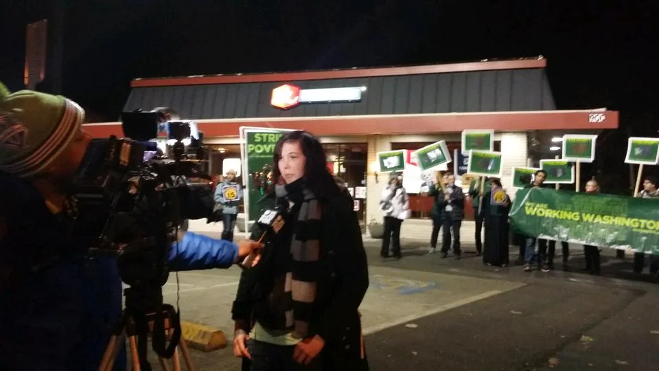 Lucy talks to the media about why she's on strike for $15 today.