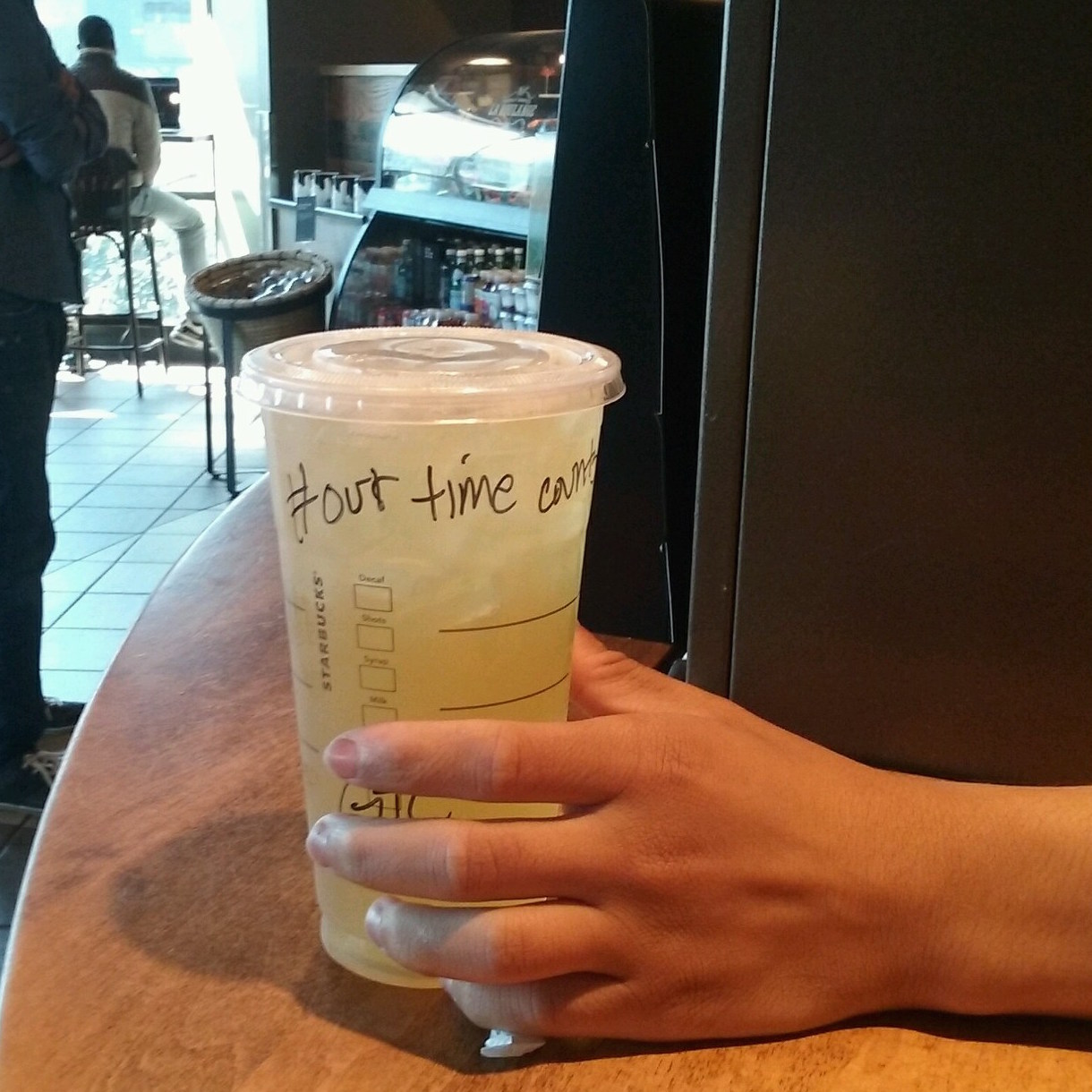 File photo: #OurTimeCounts on iced drink cup.