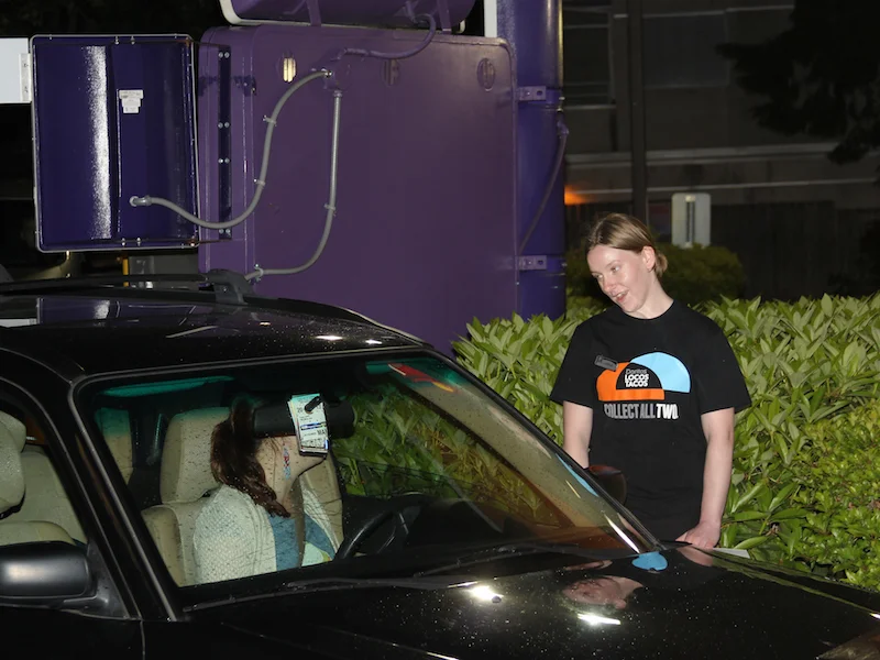 Above: May 2013 — Caroline Durocher reaches out to customers after becoming the first Seattle fast food worker to walk out on strike.
