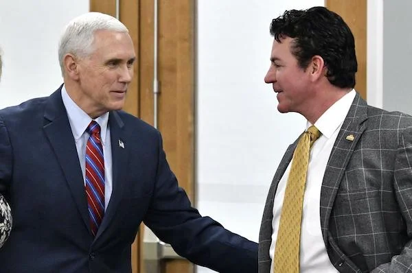 Above: Papa John's outgoing CEO with Vice President Mike Pence, in 2017.