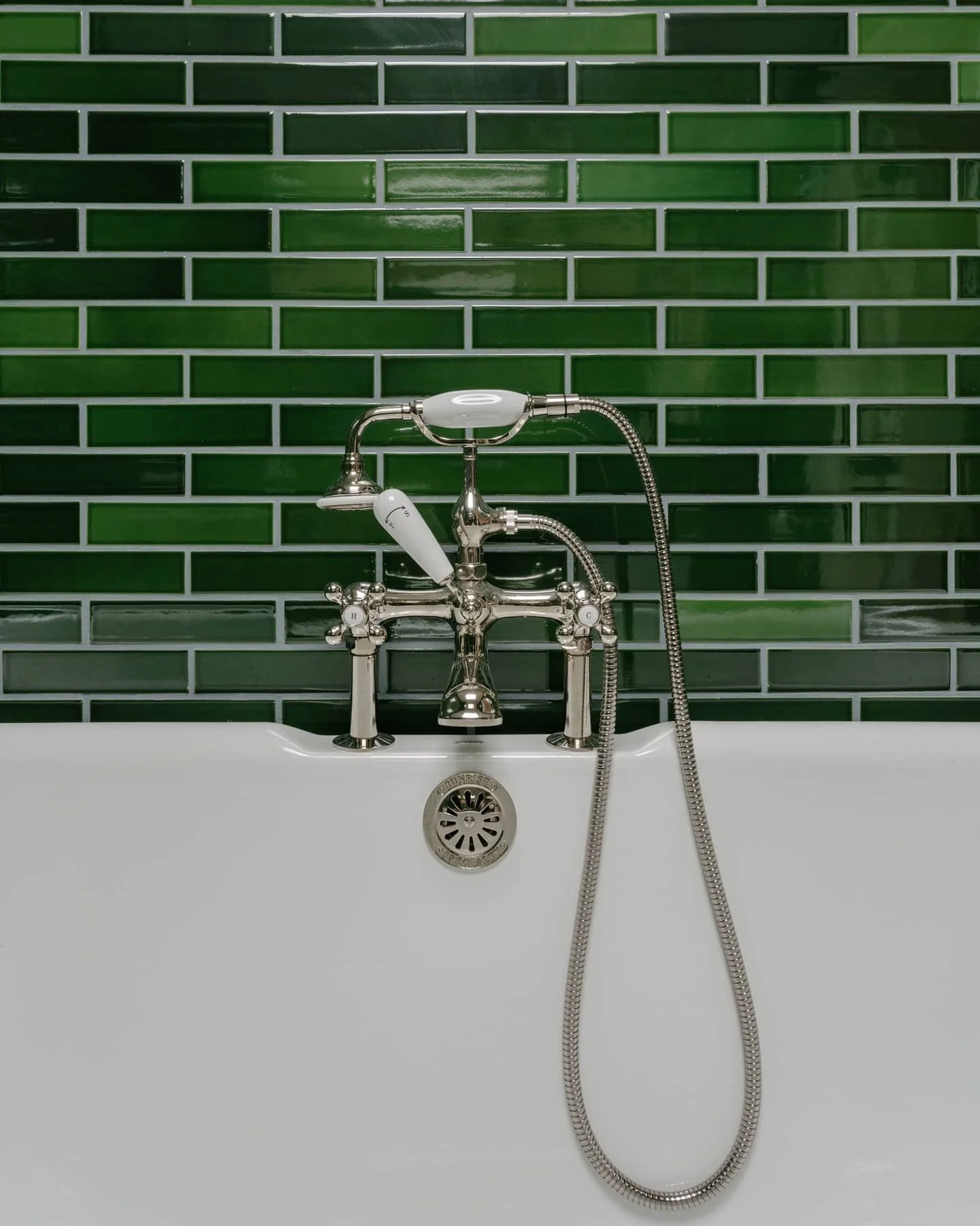 The color on this Jade ceramic from @tilemakestheroom is really spectacular. Skylight above a claw foot rub on the top floor of the Sunset Park Townhouse. 📸@nickglimenakis 

#janekimdesign #interior #architecture #tile #bathroom #townhouse #renovati