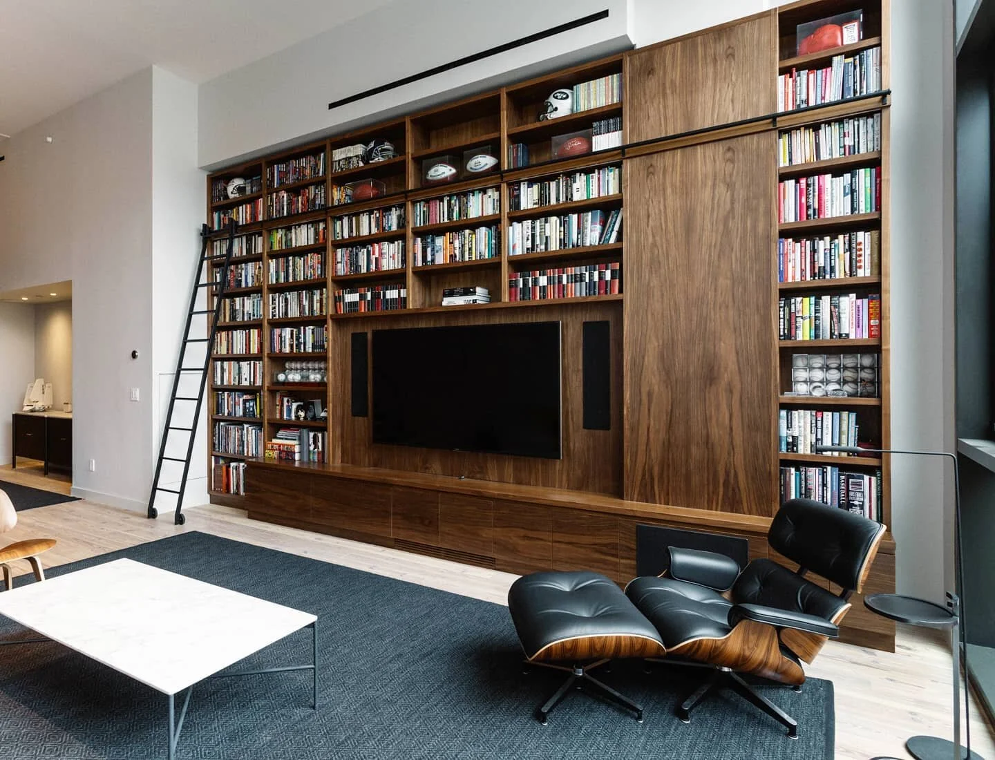 We worked back and forth with our Furman St. Duplex client to design the perfect bookshelf for the room, starting with the linear feet of books it needed to hold and the audio system that would be housed within it. Photos: @nickglimenakis 

#interior