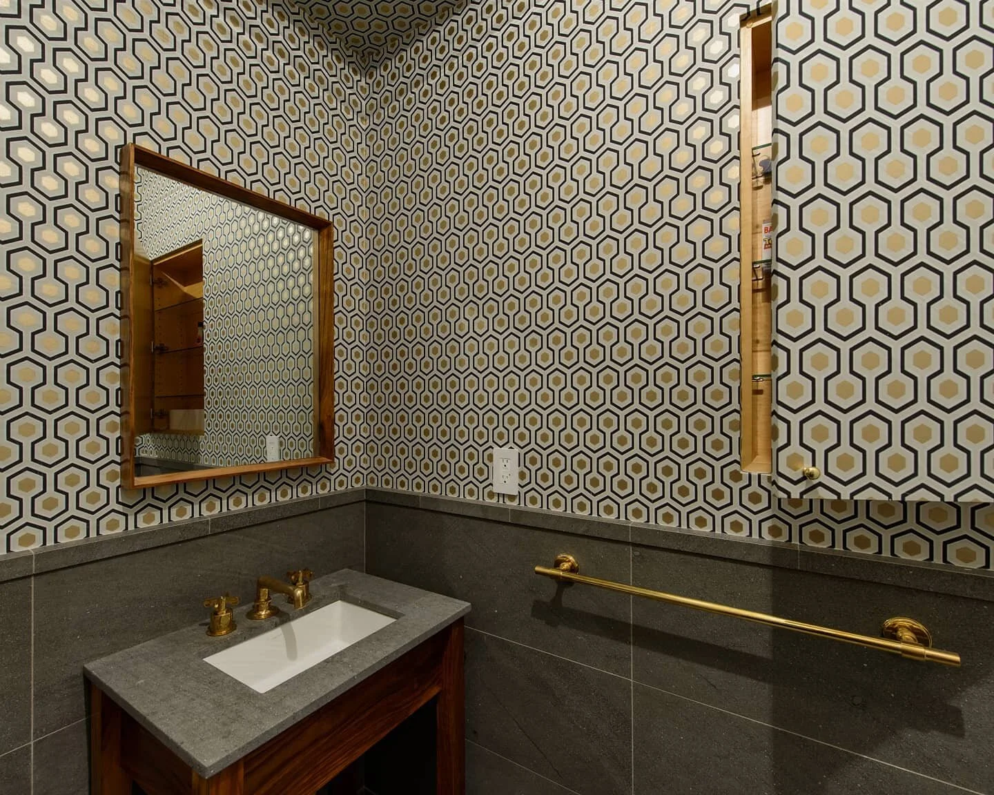 Glamorous geometric wallpaper from @cole_and_son_wallpapers and a hidden cabinet in the powder room at our East Village Apartment. 

#interior #architecture #details #janekimdesign #renovation #nyc #apartment #wallpaper #powderoom #gold