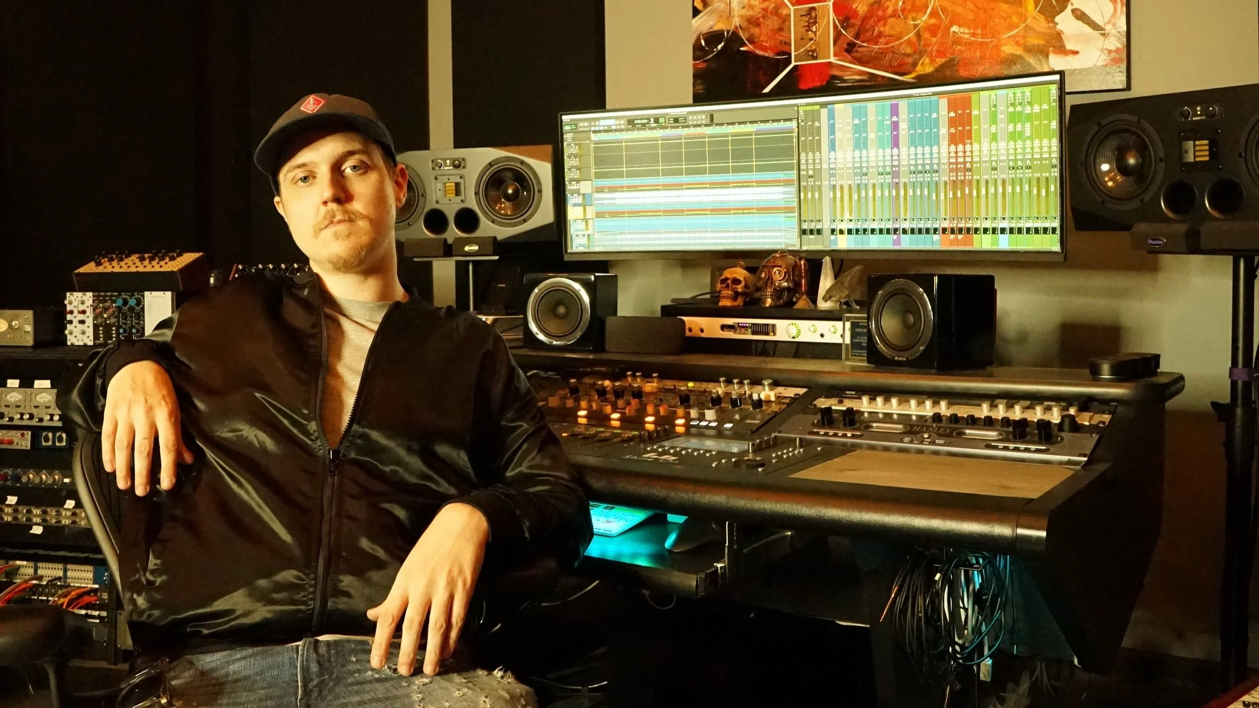 Devin Jergentz produces music at Shine On Studio in Oakland, CA. This image depicts him sitting at the main console where he does most of his audio production work.