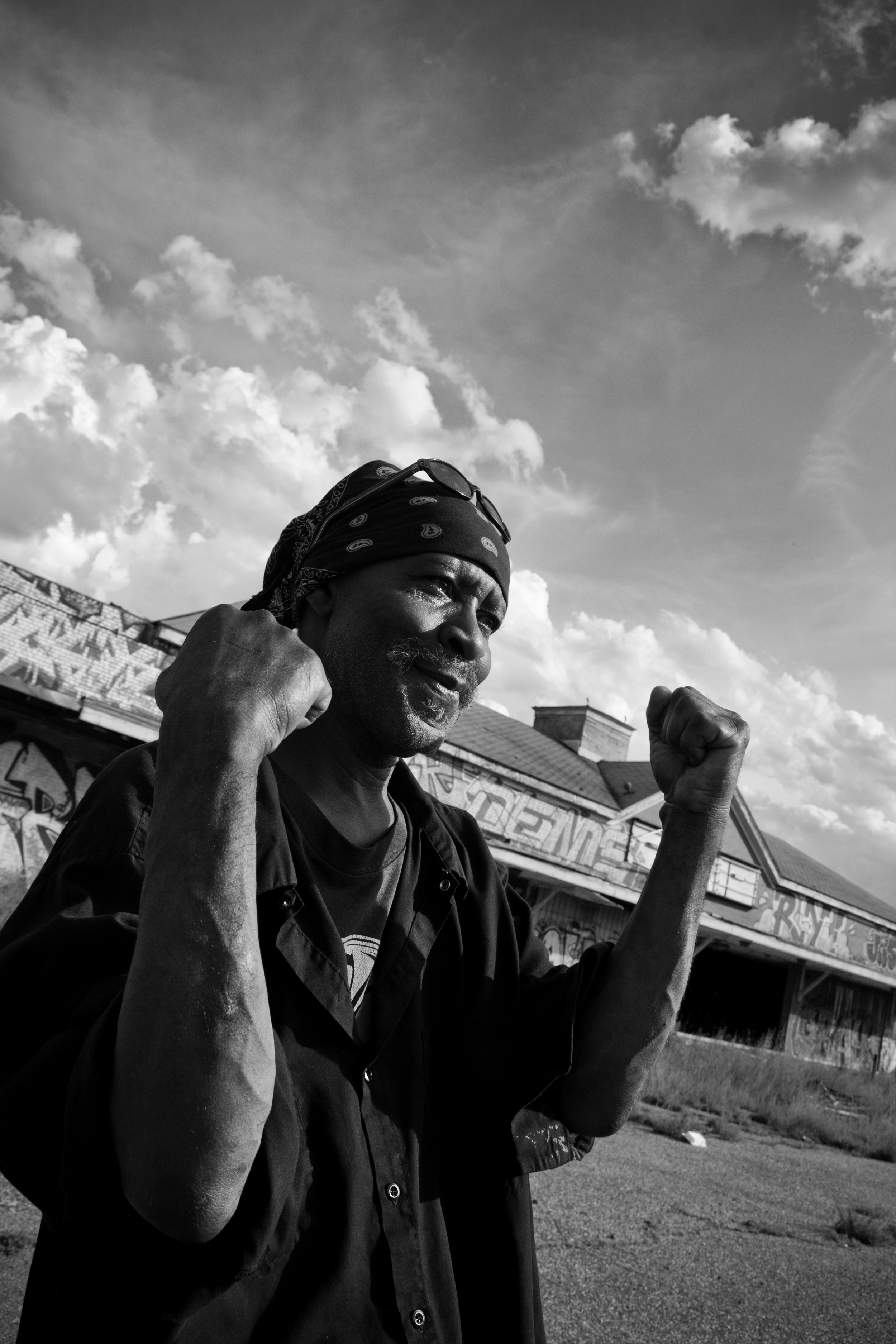  Local Ronny "Packard" poses for a photo and shows scars from gunshots he claims he received after a confrontation with a man scrapping for metal at the Packard Plant. Ronny is one of many who feel metal scrappers destroy property and cause problems 