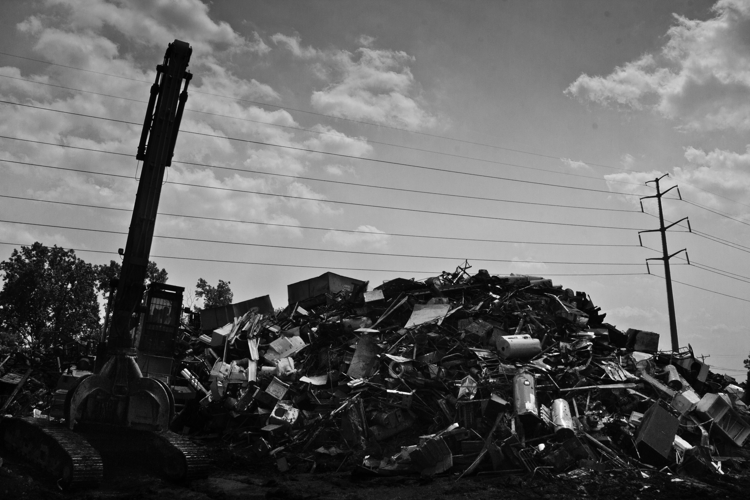 Purchased metal of all types stacked into piles before it is sorted, recycled, and then exported. Many scrapyards deal primarily with industry scrap metal in order to avoid the legal issues surrounding individual scrappers. H&H Metals, Det