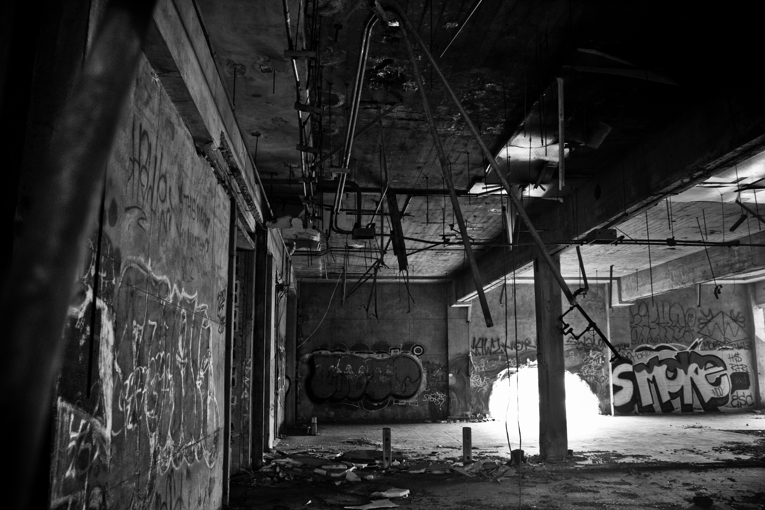 An abandoned warehouse lies gutted, a clear sign that scrappers have been here before.