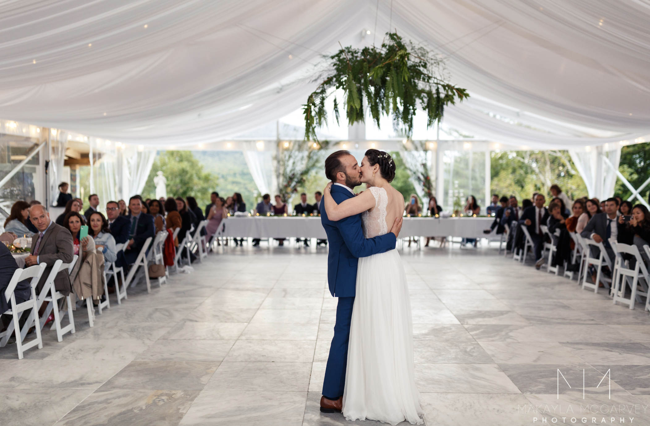 first dance kiss in the tent.png