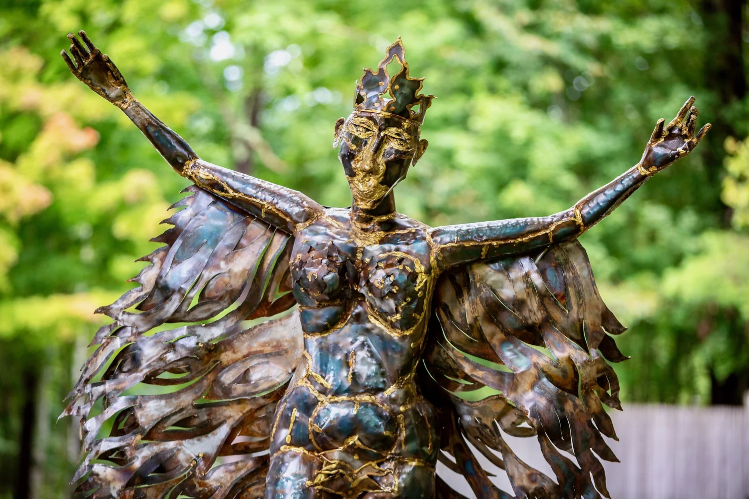 a statue of a person with a crown and a cross