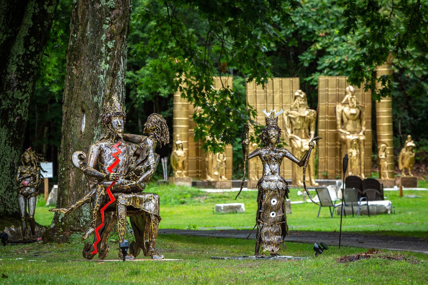 a group of statues in a park