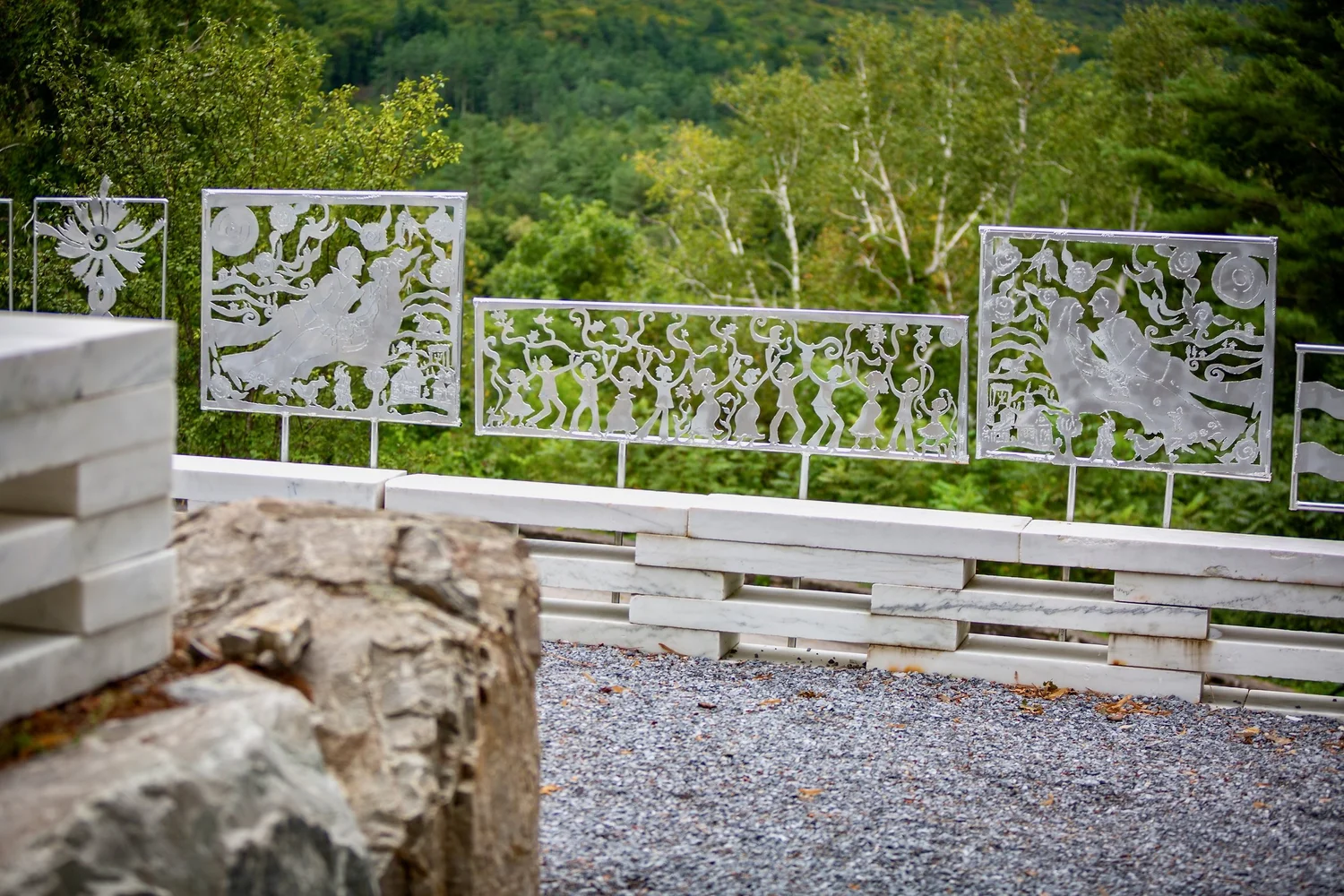 a white fence with a sign on it