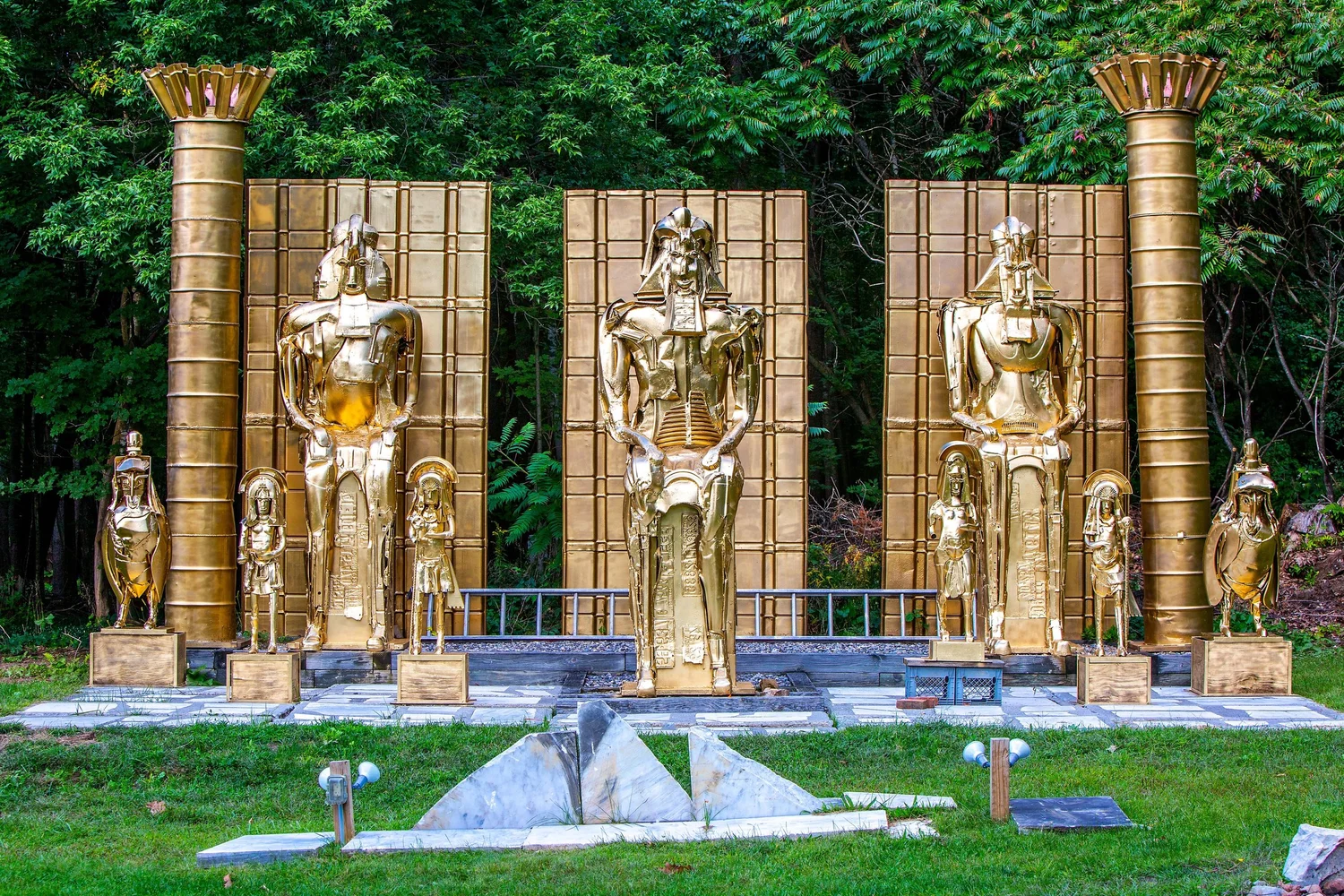 a group of statues in a park