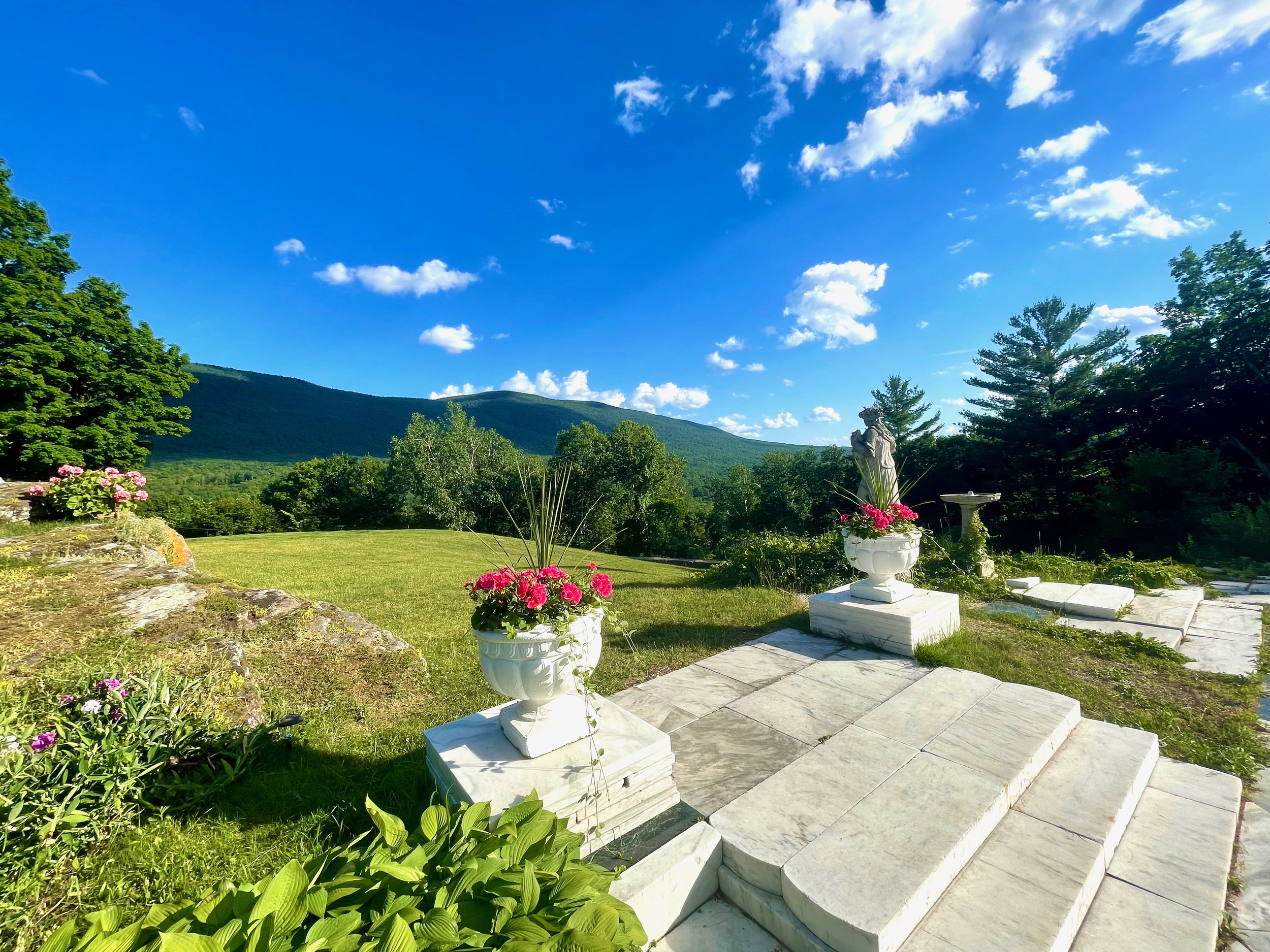 Summer marble patio view of front lawn at The Wilburton.jpeg