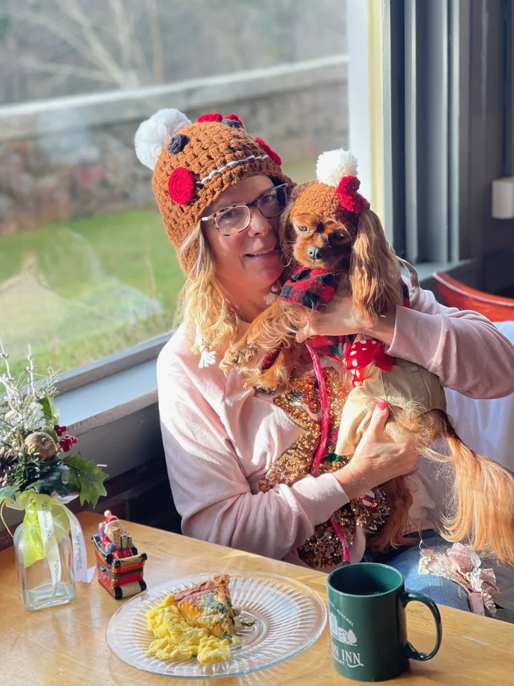 a woman in a garment sitting at a table