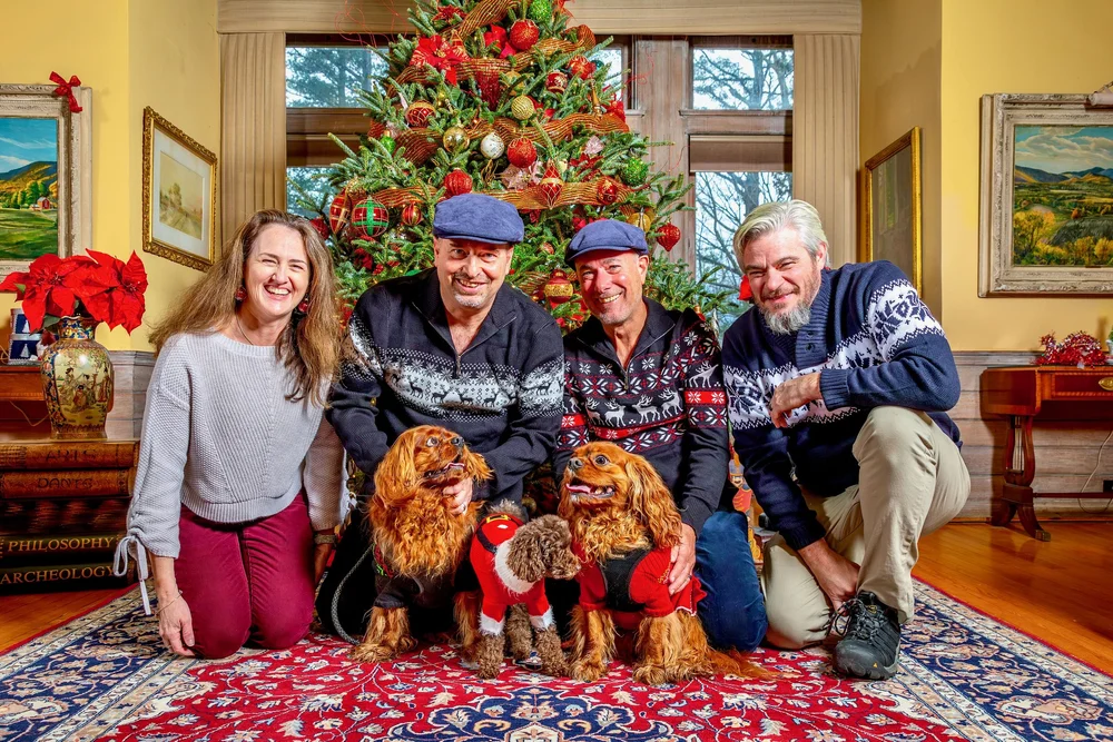 a group of people posing for a photo with a dog