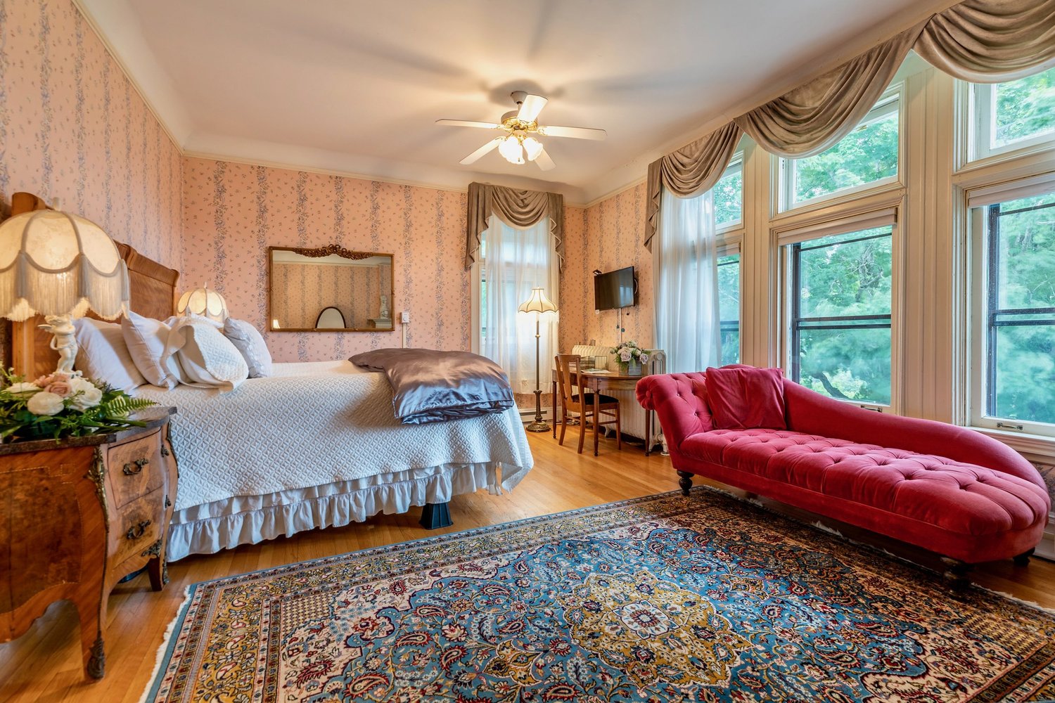 a bedroom with a bed and a couch