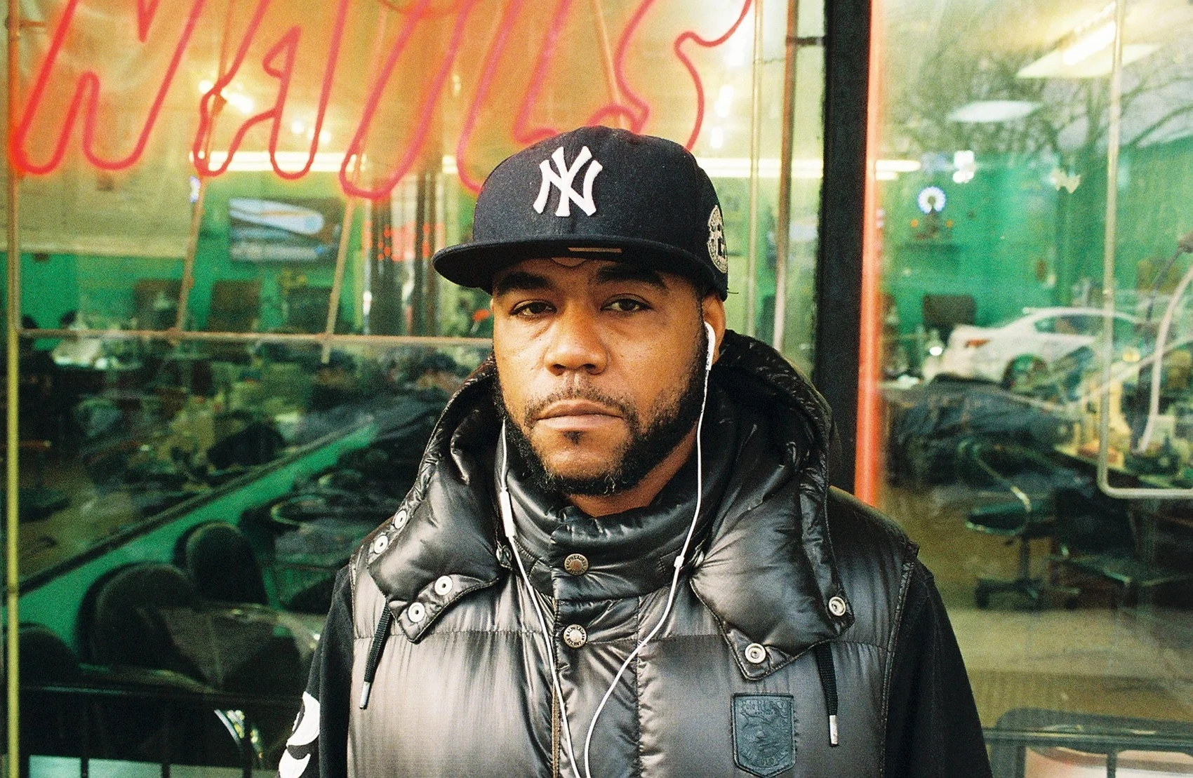  Rob stands outside of a nail salon in Harlem, he allows himself to be photographed, but is hesitant to contribute to the conversation. 