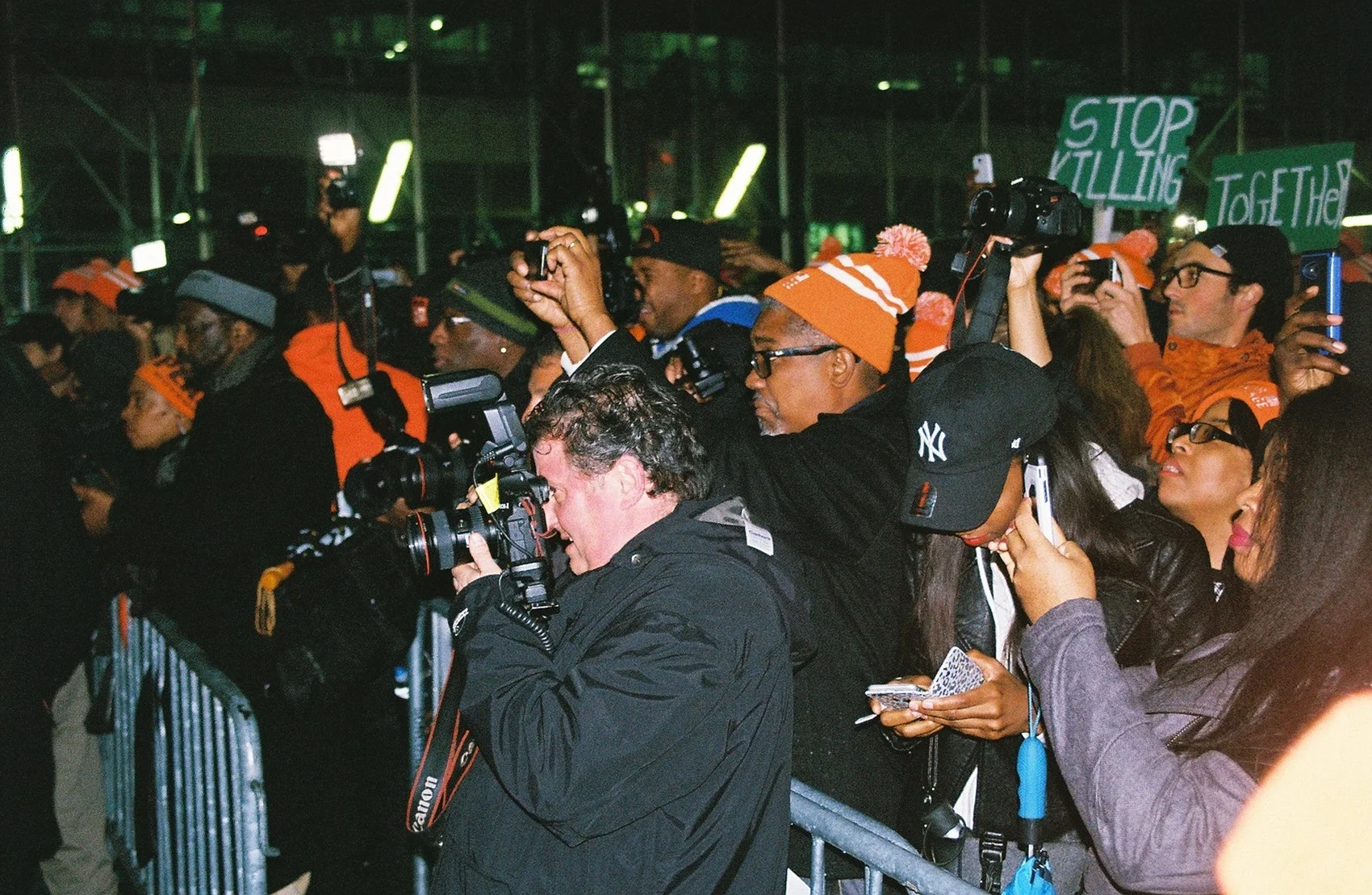  Protestors and photographers push to the front of the March For Peace rally. 